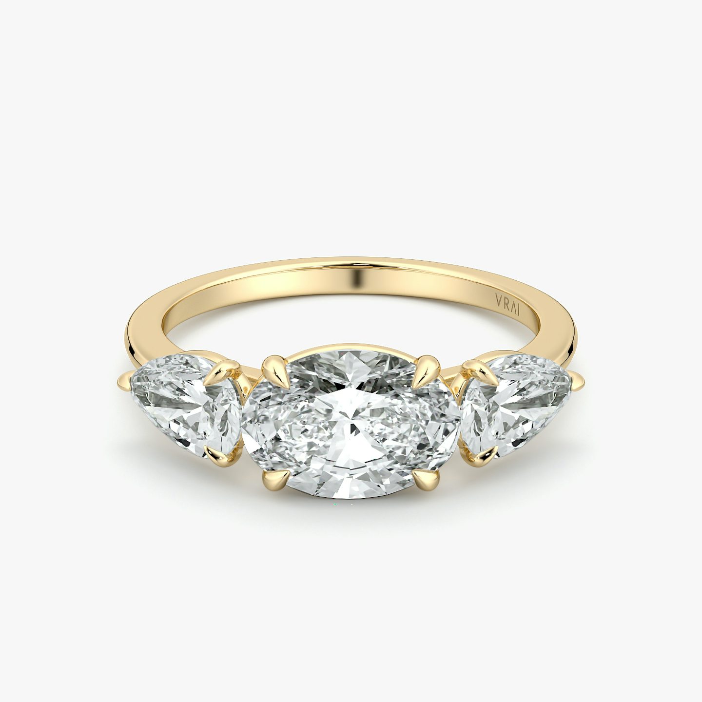 The Three Stone | Oval | 18k | Yellow Gold | bandAccent: Plain | diamondOrientation: horizontal | sideStoneCarat: 0.50ct | sideStoneShape: Pear | caratWeight: other