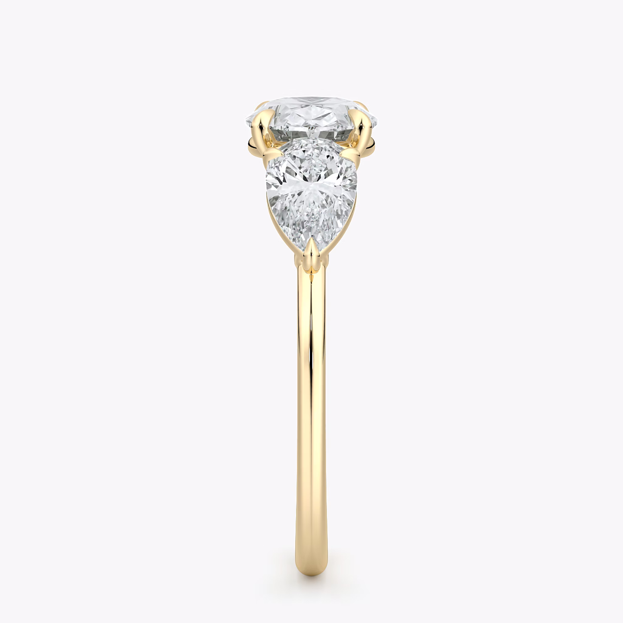 The Three Stone | Oval | 18k | Yellow Gold | bandAccent: Plain | diamondOrientation: horizontal | sideStoneCarat: 0.50ct | sideStoneShape: Pear | caratWeight: other