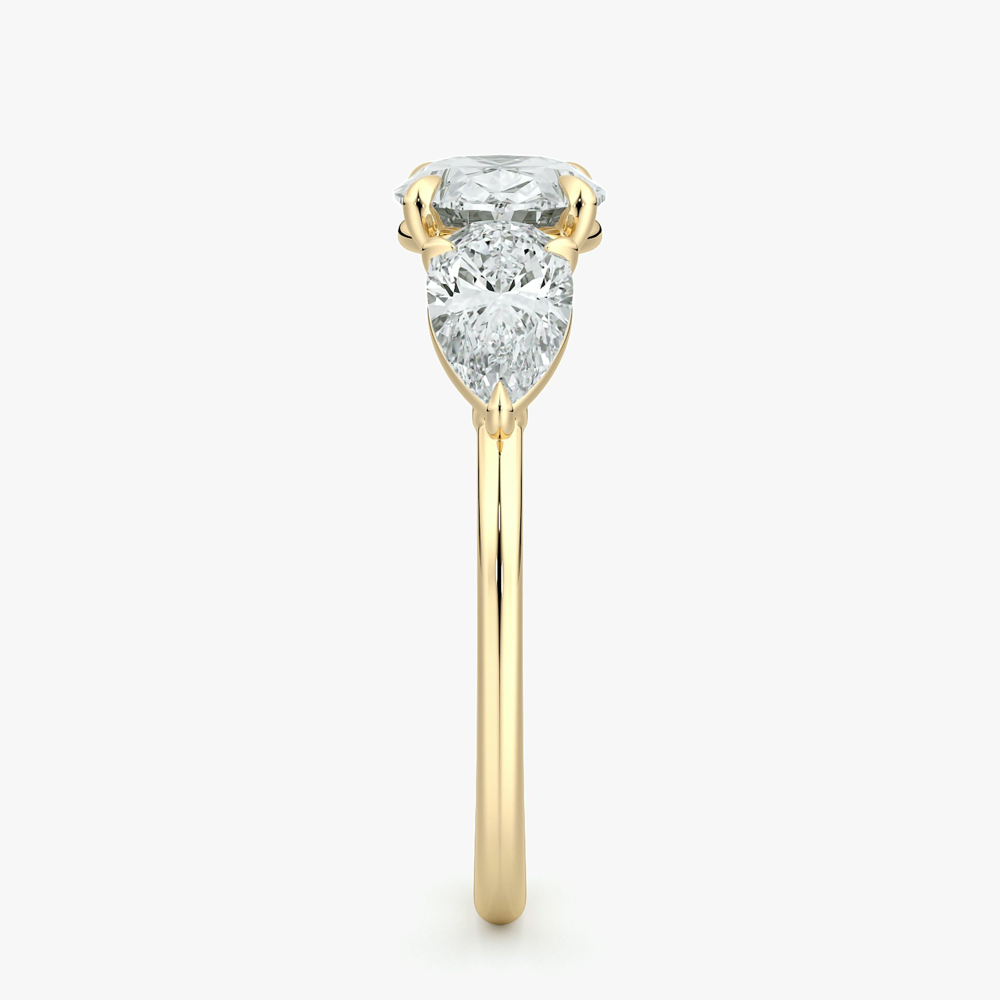 The Three Stone | Oval | 18k | Yellow Gold | bandAccent: Plain | diamondOrientation: horizontal | sideStoneCarat: 0.50ct | sideStoneShape: Pear | caratWeight: other