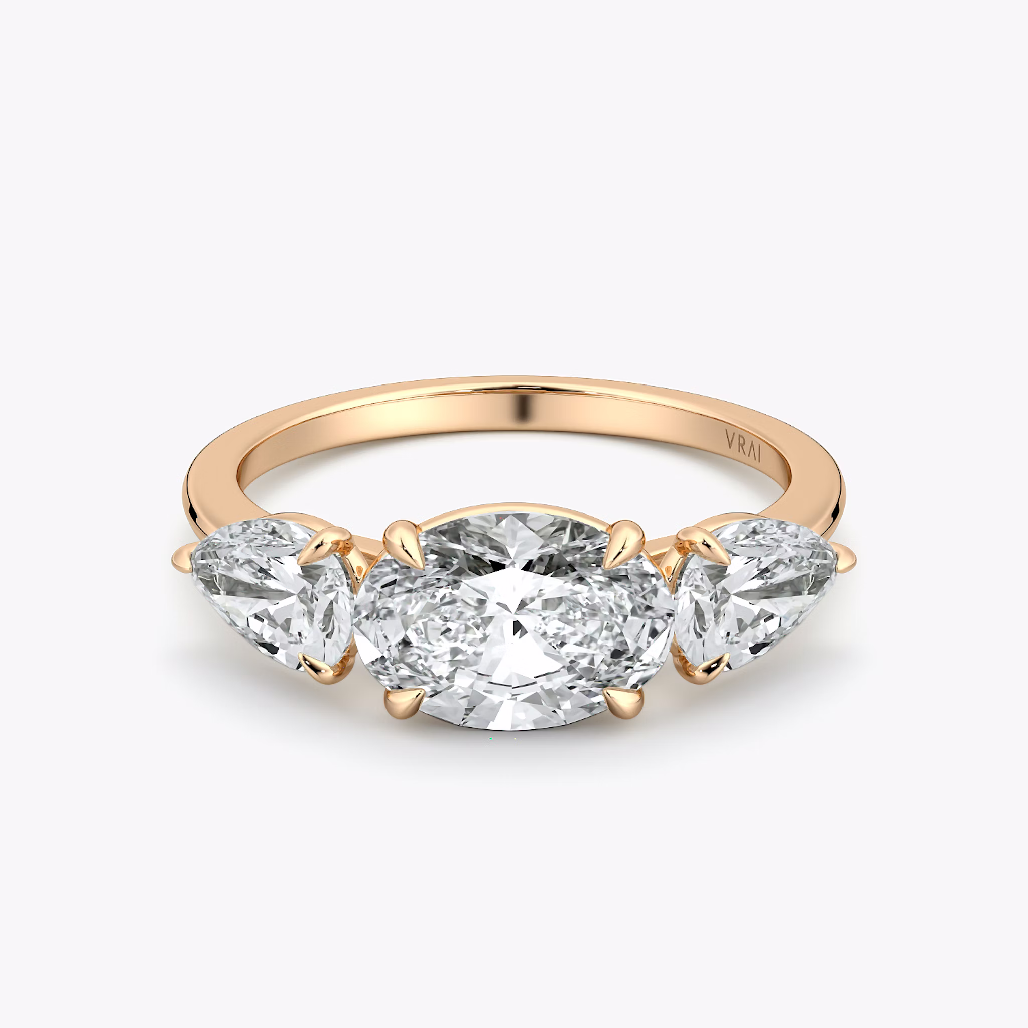 The Three Stone | Oval | 14k | Rose Gold | bandAccent: Plain | diamondOrientation: horizontal | sideStoneCarat: 0.50ct | sideStoneShape: Pear | caratWeight: other