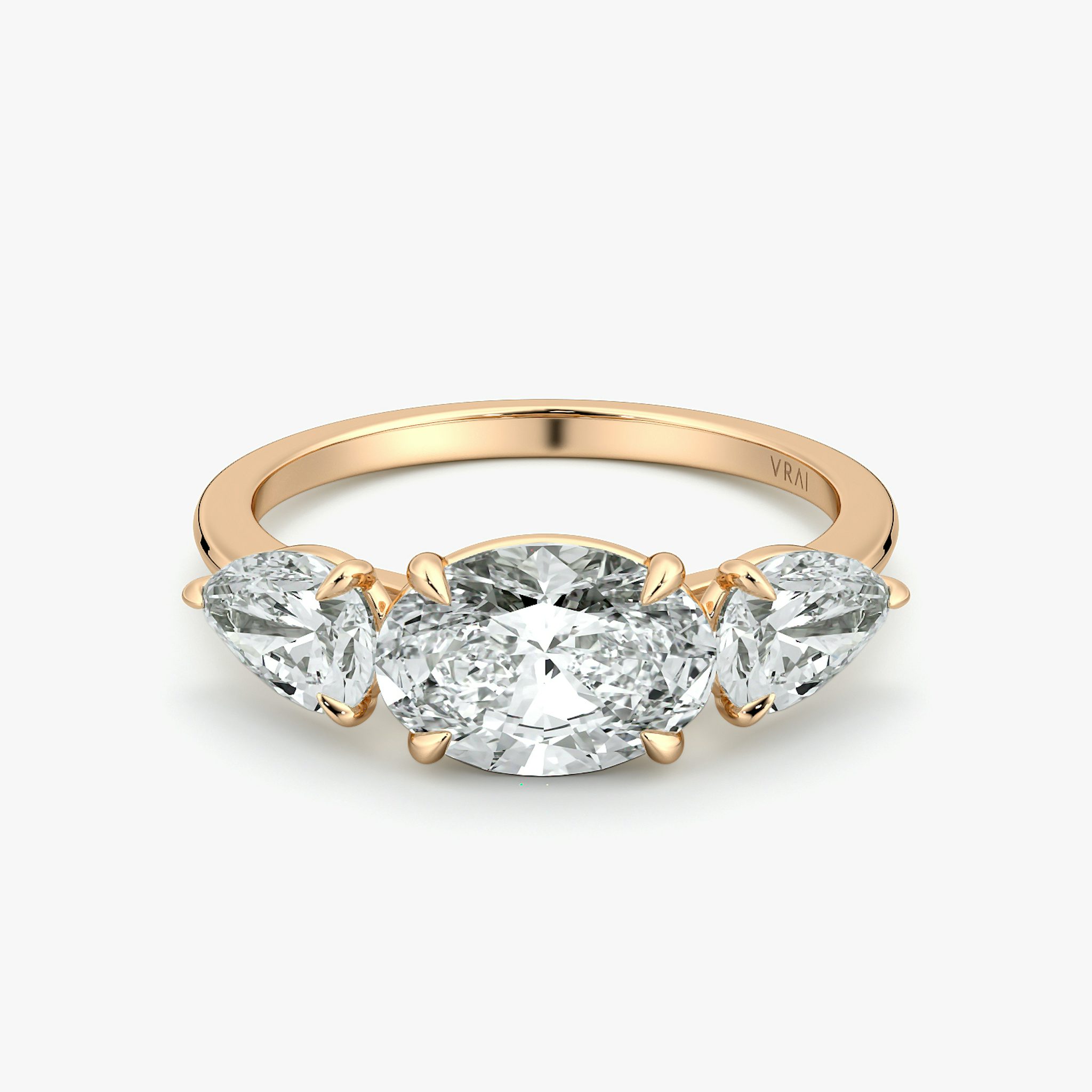 The Three Stone | Oval | 14k | Rose Gold | bandAccent: Plain | diamondOrientation: horizontal | sideStoneCarat: 0.50ct | sideStoneShape: Pear | caratWeight: other
