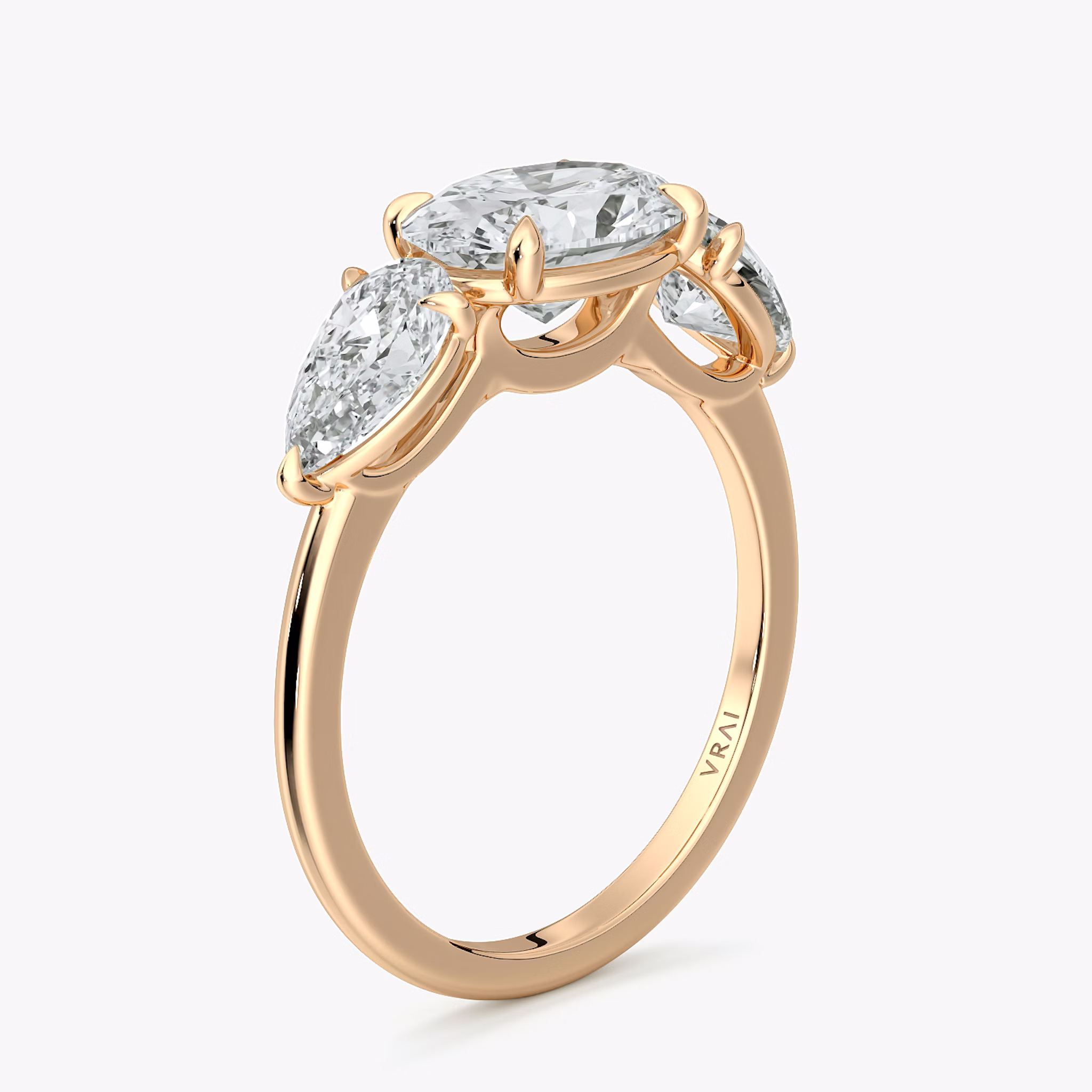 The Three Stone | Oval | 14k | Rose Gold | bandAccent: Plain | diamondOrientation: horizontal | sideStoneCarat: 0.50ct | sideStoneShape: Pear | caratWeight: other