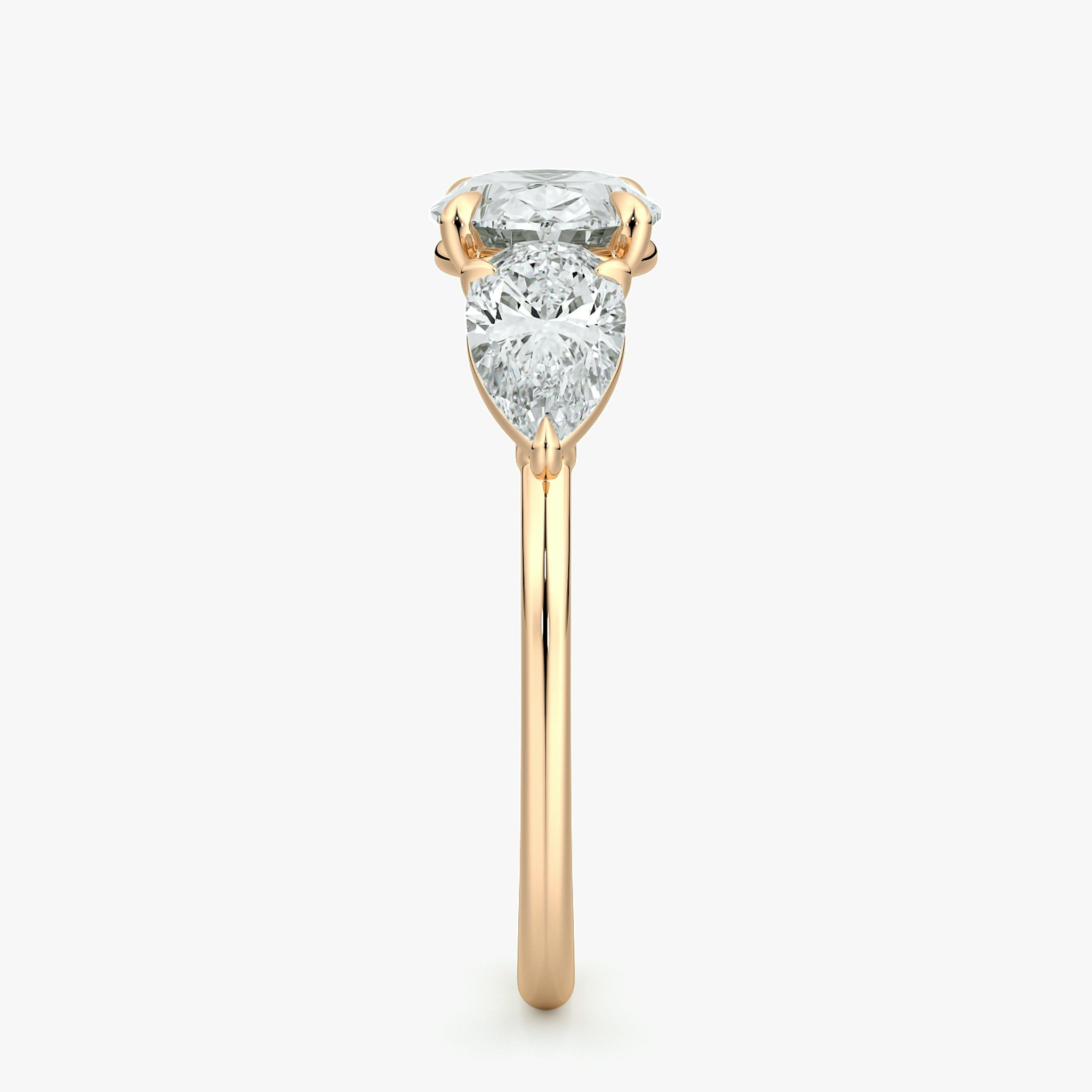 The Three Stone | Oval | 14k | Rose Gold | bandAccent: Plain | diamondOrientation: horizontal | sideStoneCarat: 0.50ct | sideStoneShape: Pear | caratWeight: other