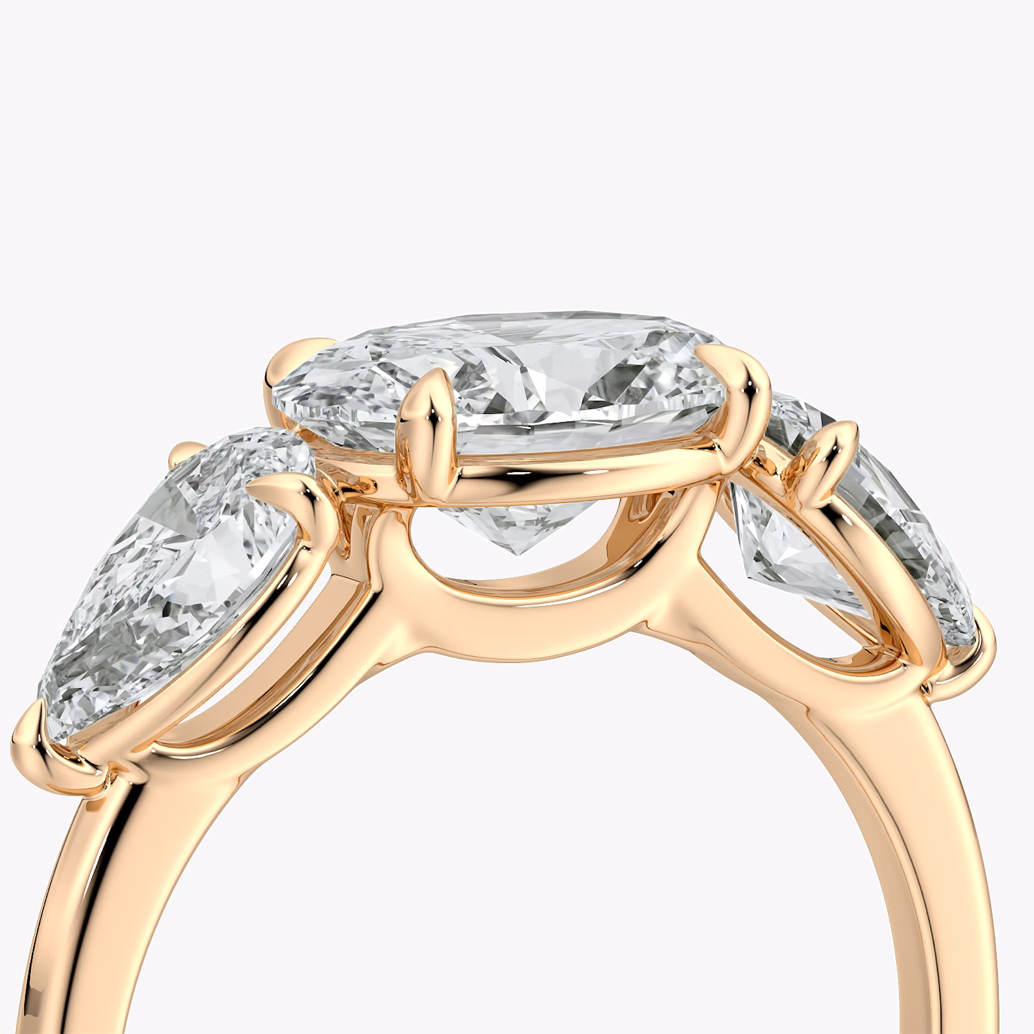 The Three Stone | Oval | 14k | Rose Gold | bandAccent: Plain | diamondOrientation: horizontal | sideStoneCarat: 0.50ct | sideStoneShape: Pear | caratWeight: other