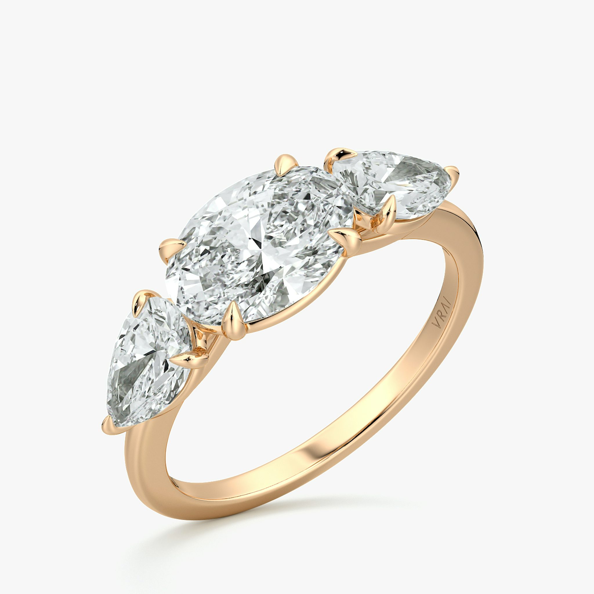 The Three Stone | Oval | 14k | Rose Gold | bandAccent: Plain | diamondOrientation: horizontal | sideStoneCarat: 0.50ct | sideStoneShape: Pear | caratWeight: other