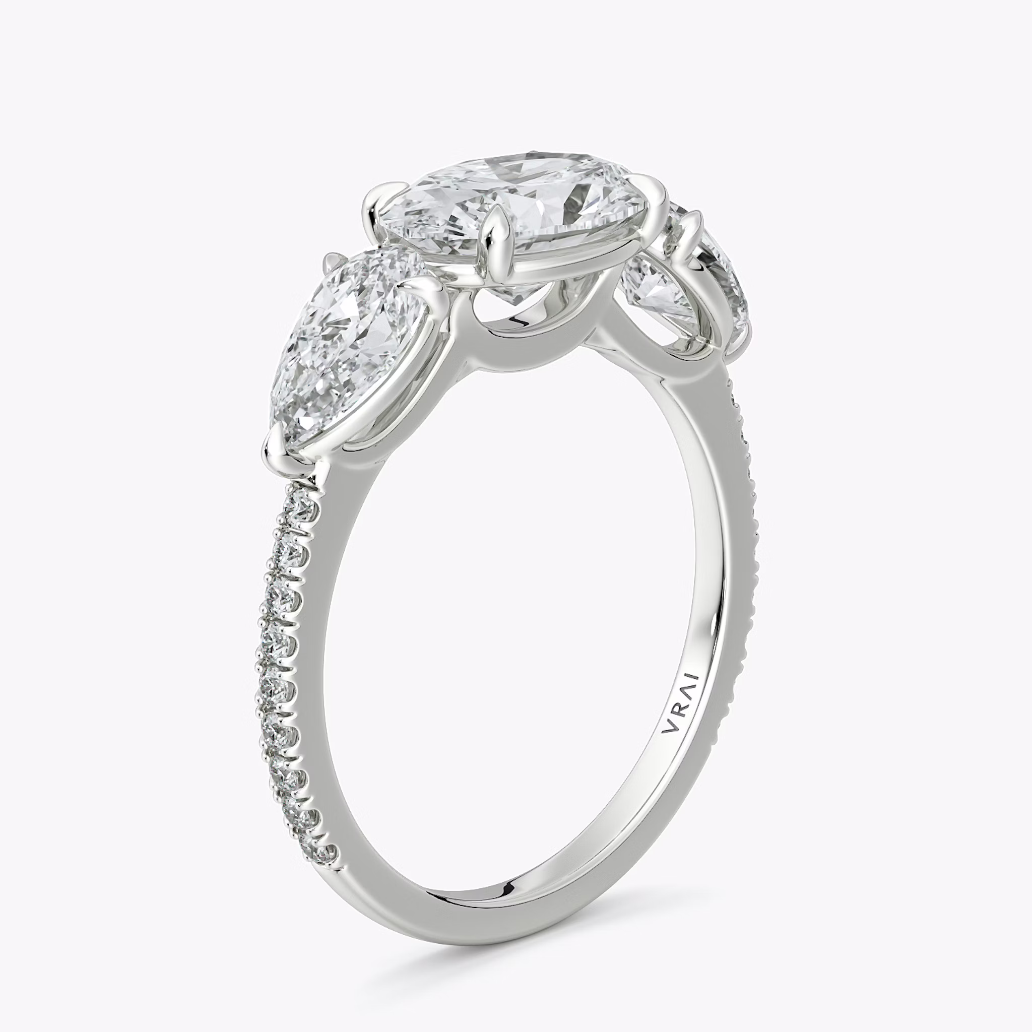 The Three Stone | Oval | 18k | White Gold | bandAccent: Pavé | diamondOrientation: horizontal | sideStoneCarat: 0.50ct | sideStoneShape: Pear | caratWeight: other