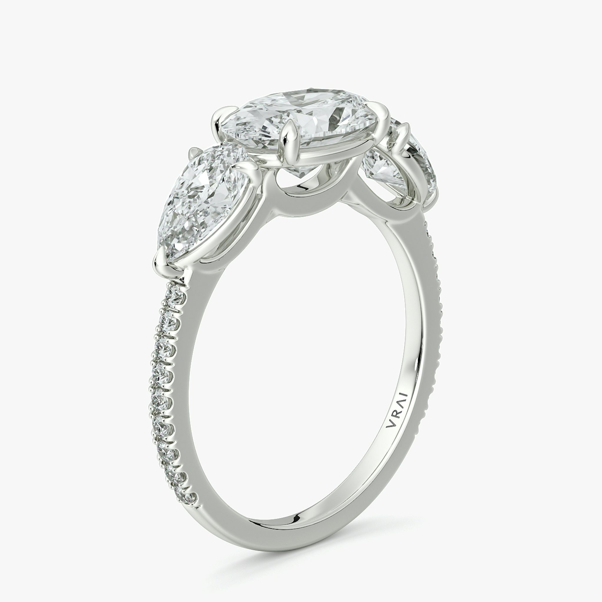 The Three Stone | Oval | 18k | White Gold | bandAccent: Pavé | diamondOrientation: horizontal | sideStoneCarat: 0.50ct | sideStoneShape: Pear | caratWeight: other