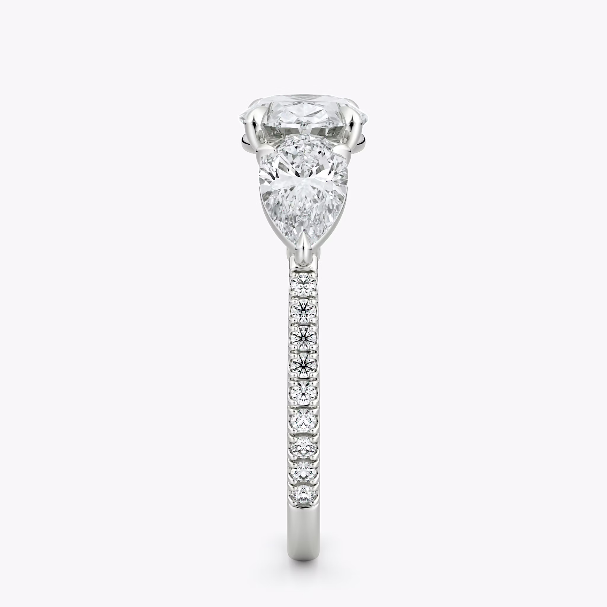 The Three Stone | Oval | 18k | White Gold | bandAccent: Pavé | diamondOrientation: horizontal | sideStoneCarat: 0.50ct | sideStoneShape: Pear | caratWeight: other