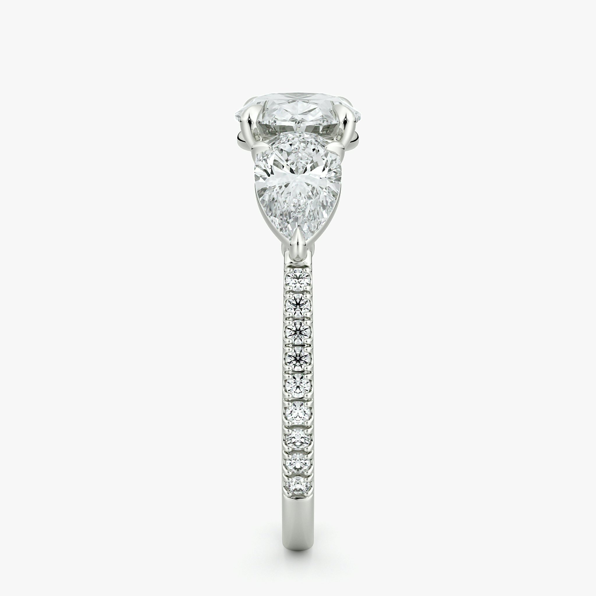 The Three Stone | Oval | 18k | White Gold | bandAccent: Pavé | diamondOrientation: horizontal | sideStoneCarat: 0.50ct | sideStoneShape: Pear | caratWeight: other