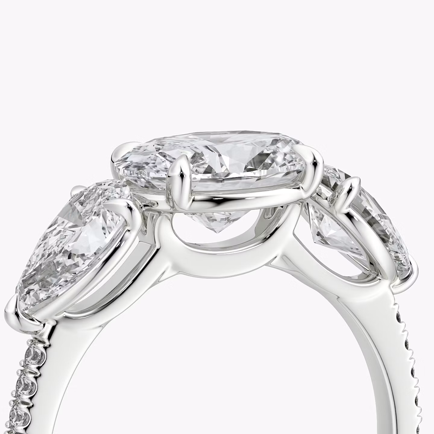 The Three Stone | Oval | Platinum | bandAccent: Pavé | diamondOrientation: horizontal | sideStoneCarat: 0.50ct | sideStoneShape: Pear | caratWeight: other