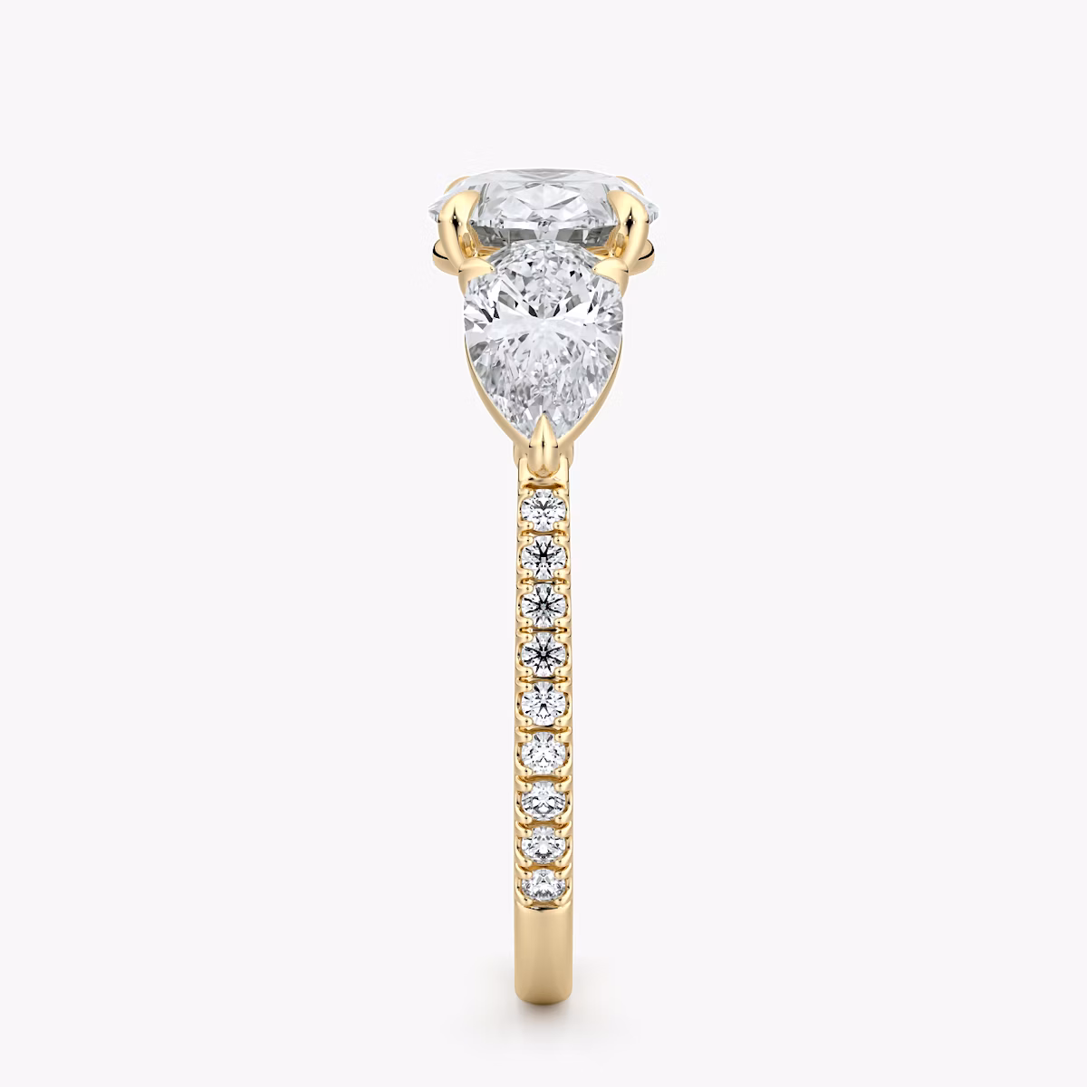The Three Stone | Oval | 18k | Yellow Gold | bandAccent: Pavé | diamondOrientation: horizontal | sideStoneCarat: 0.50ct | sideStoneShape: Pear | caratWeight: other