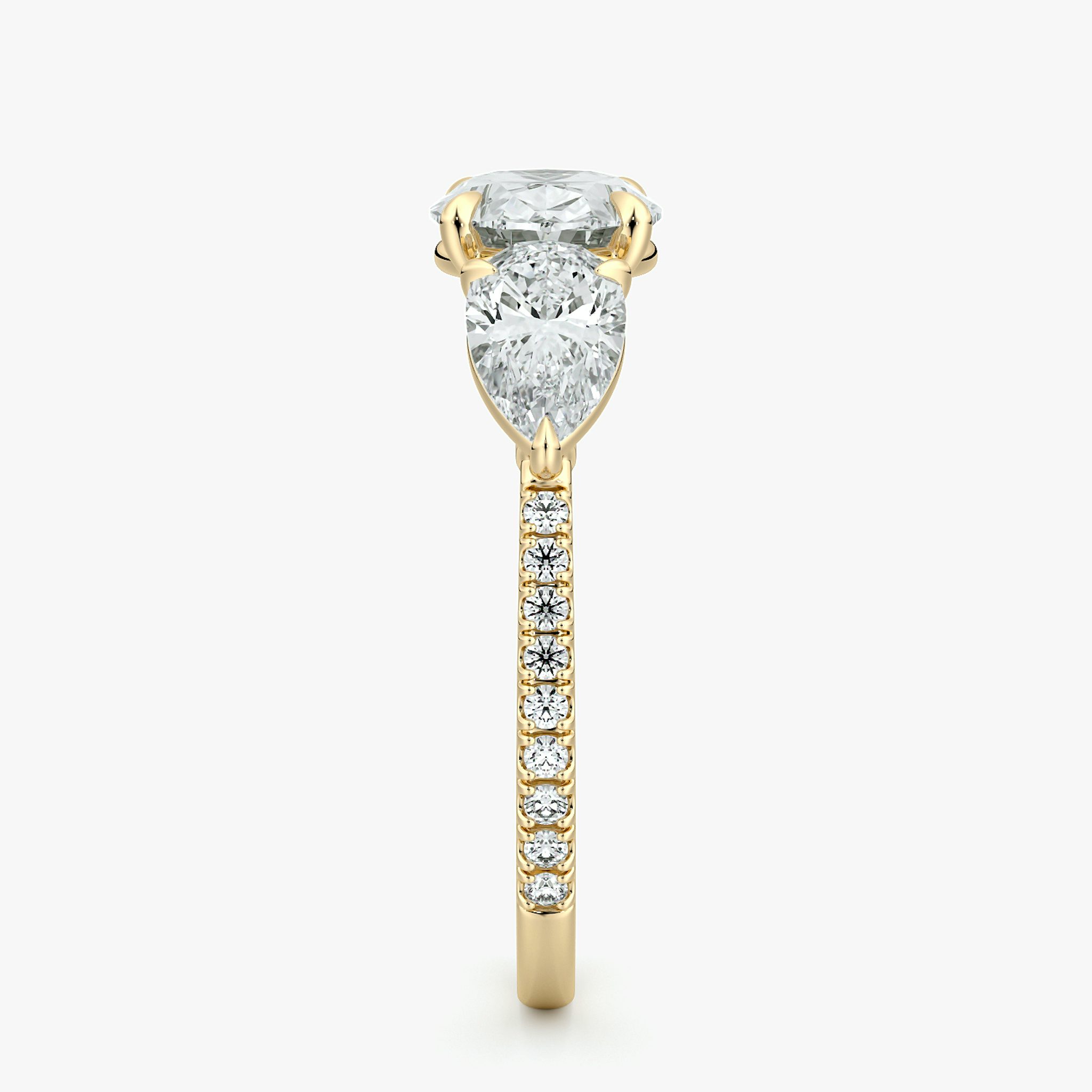 The Three Stone | Oval | 18k | Yellow Gold | bandAccent: Pavé | diamondOrientation: horizontal | sideStoneCarat: 0.50ct | sideStoneShape: Pear | caratWeight: other