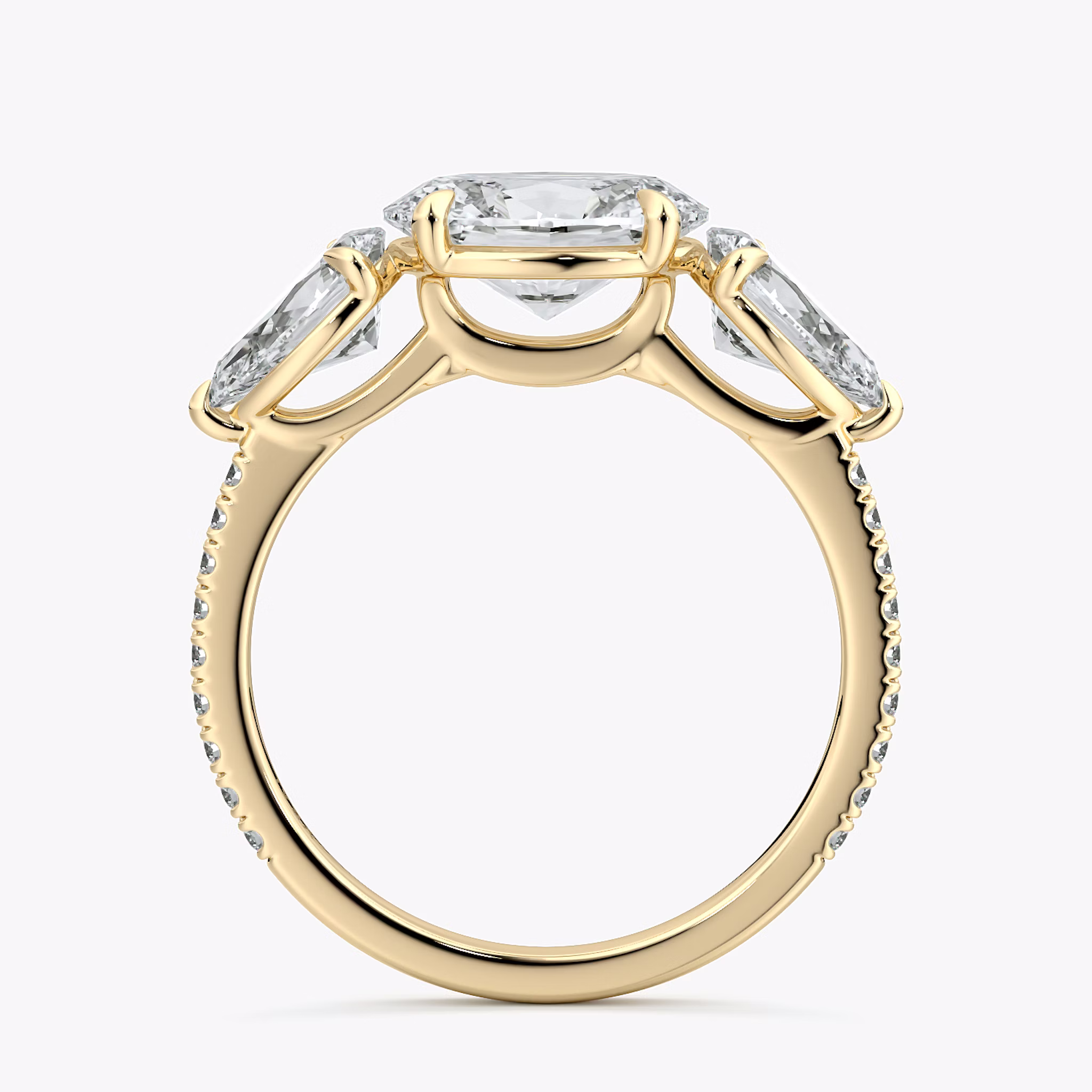 The Three Stone | Oval | 18k | Yellow Gold | bandAccent: Pavé | diamondOrientation: horizontal | sideStoneCarat: 0.50ct | sideStoneShape: Pear | caratWeight: other