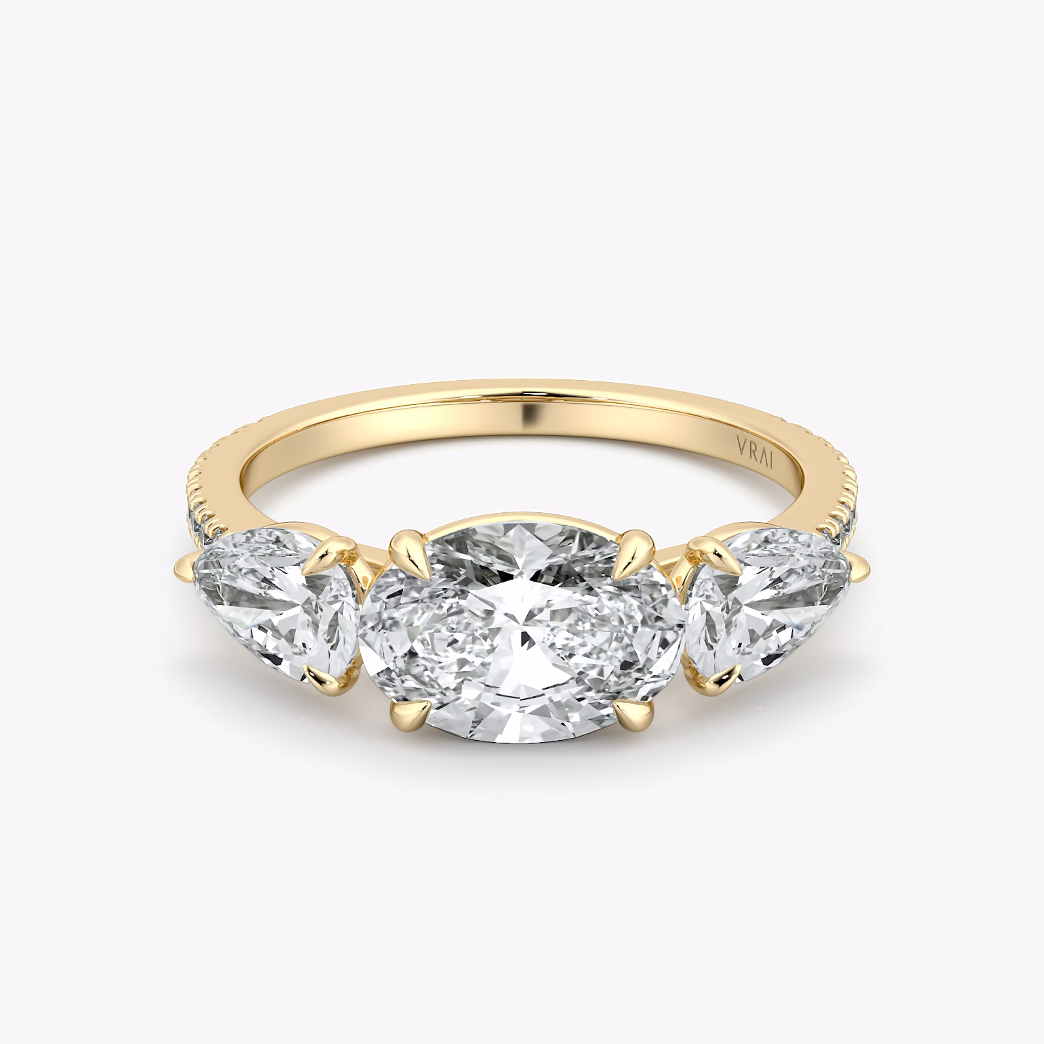 The Three Stone | Oval | 18k | Yellow Gold | bandAccent: Pavé | diamondOrientation: horizontal | sideStoneCarat: 0.50ct | sideStoneShape: Pear | caratWeight: other