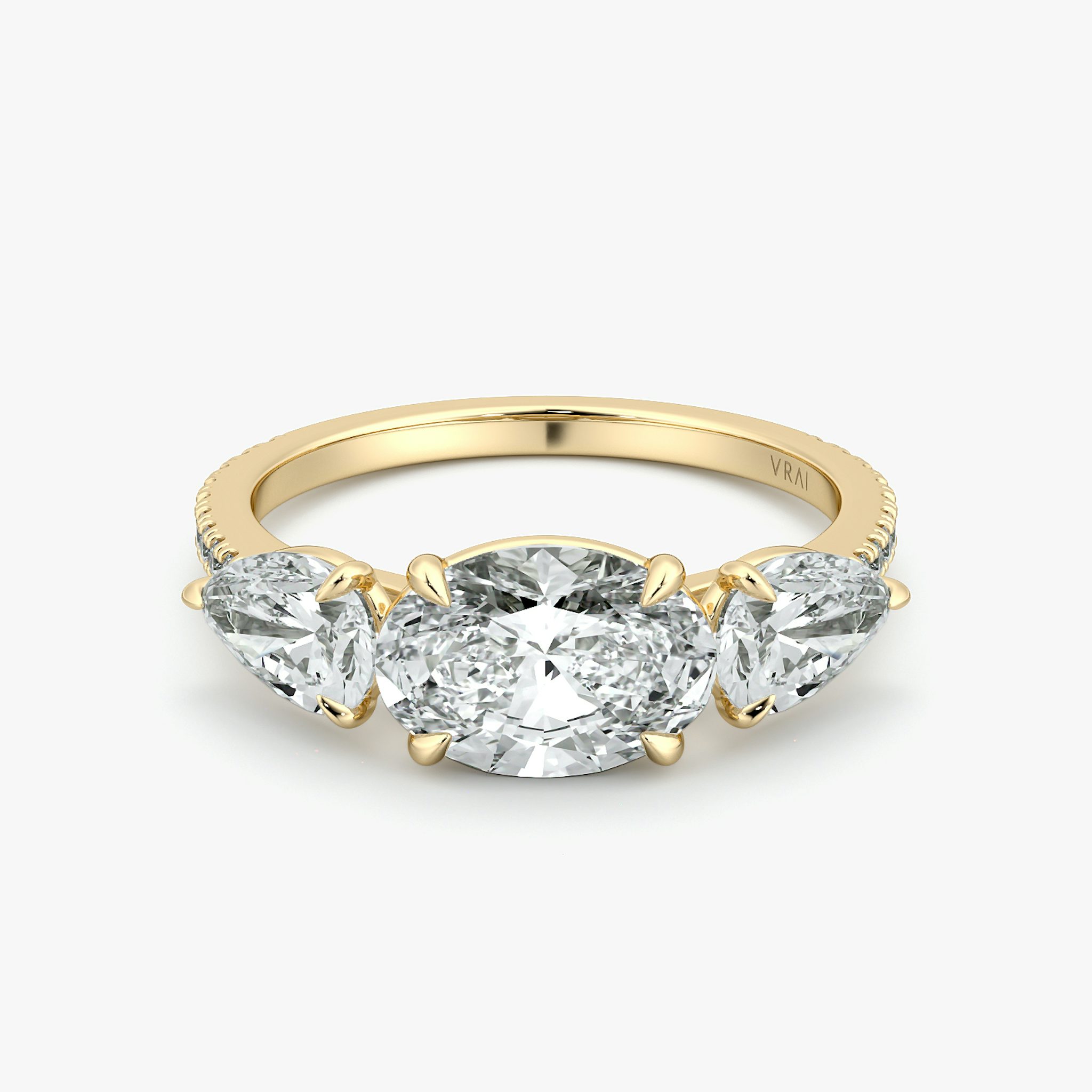 The Three Stone | Oval | 18k | Yellow Gold | bandAccent: Pavé | diamondOrientation: horizontal | sideStoneCarat: 0.50ct | sideStoneShape: Pear | caratWeight: other