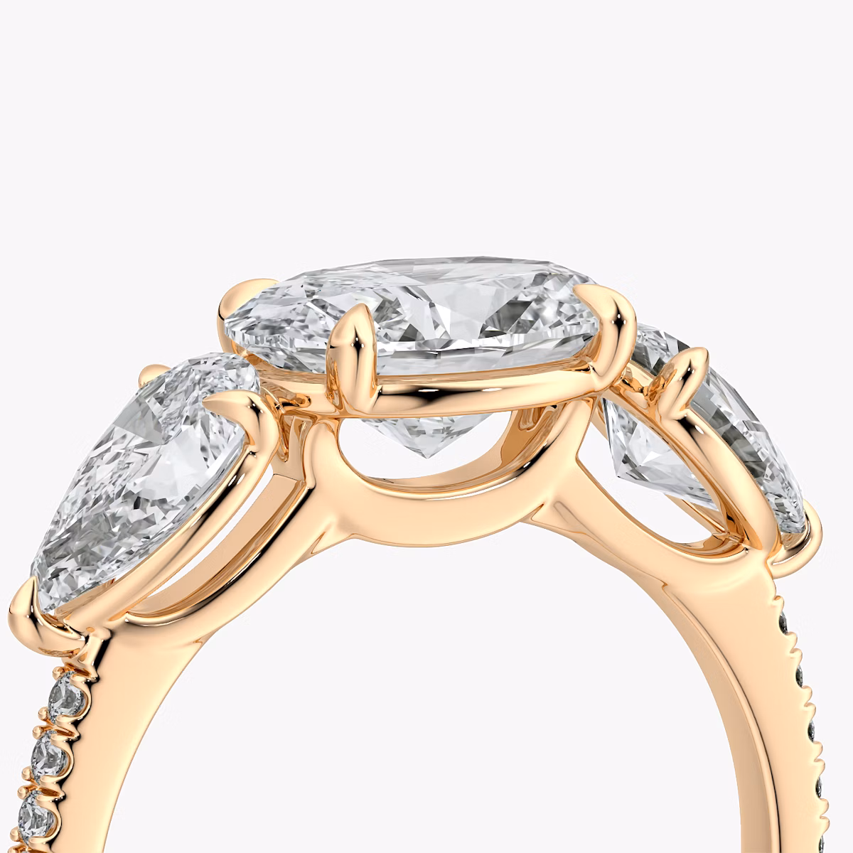 The Three Stone | Oval | 14k | Rose Gold | bandAccent: Pavé | diamondOrientation: horizontal | sideStoneCarat: 0.50ct | sideStoneShape: Pear | caratWeight: other