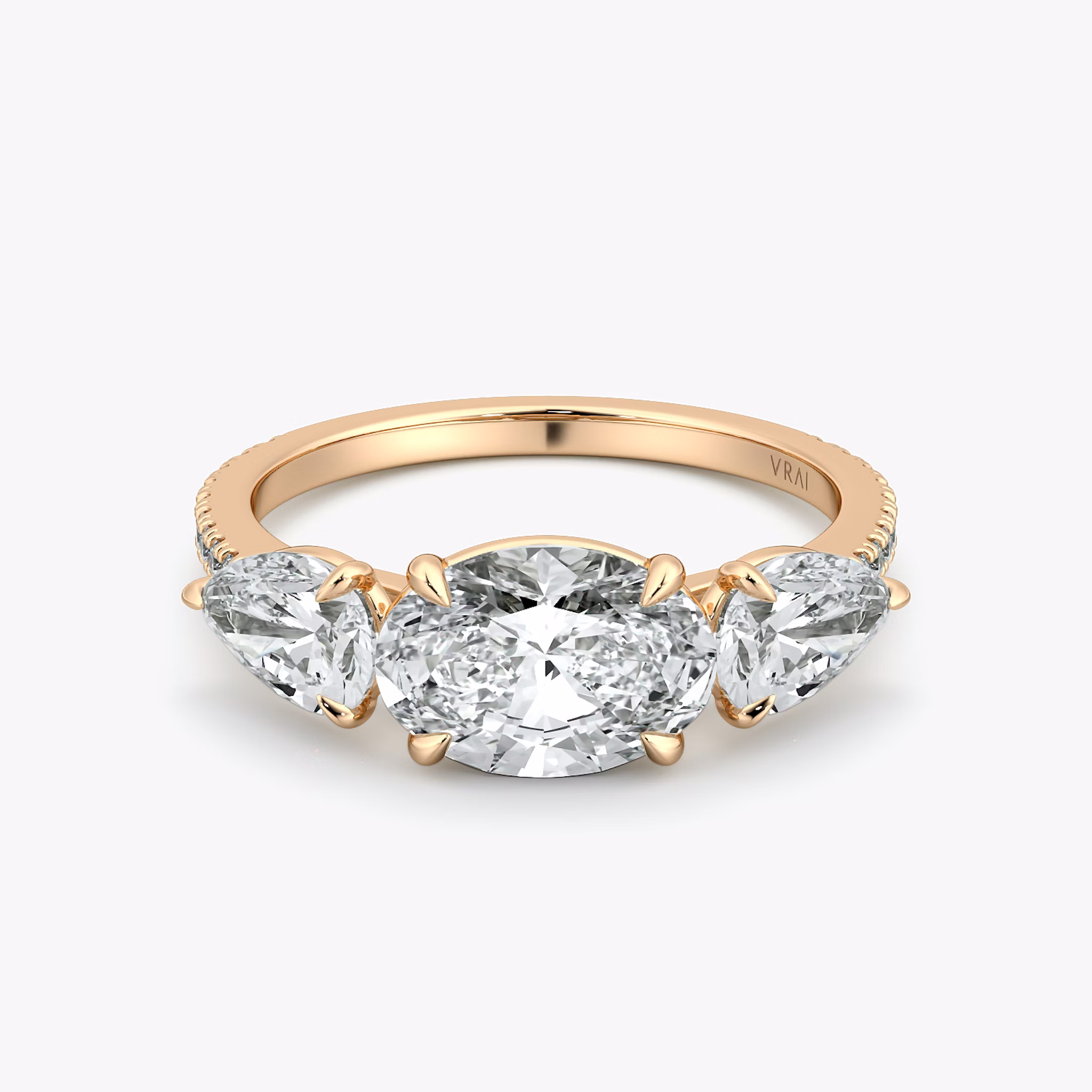The Three Stone | Oval | 14k | Rose Gold | bandAccent: Pavé | diamondOrientation: horizontal | sideStoneCarat: 0.50ct | sideStoneShape: Pear | caratWeight: other