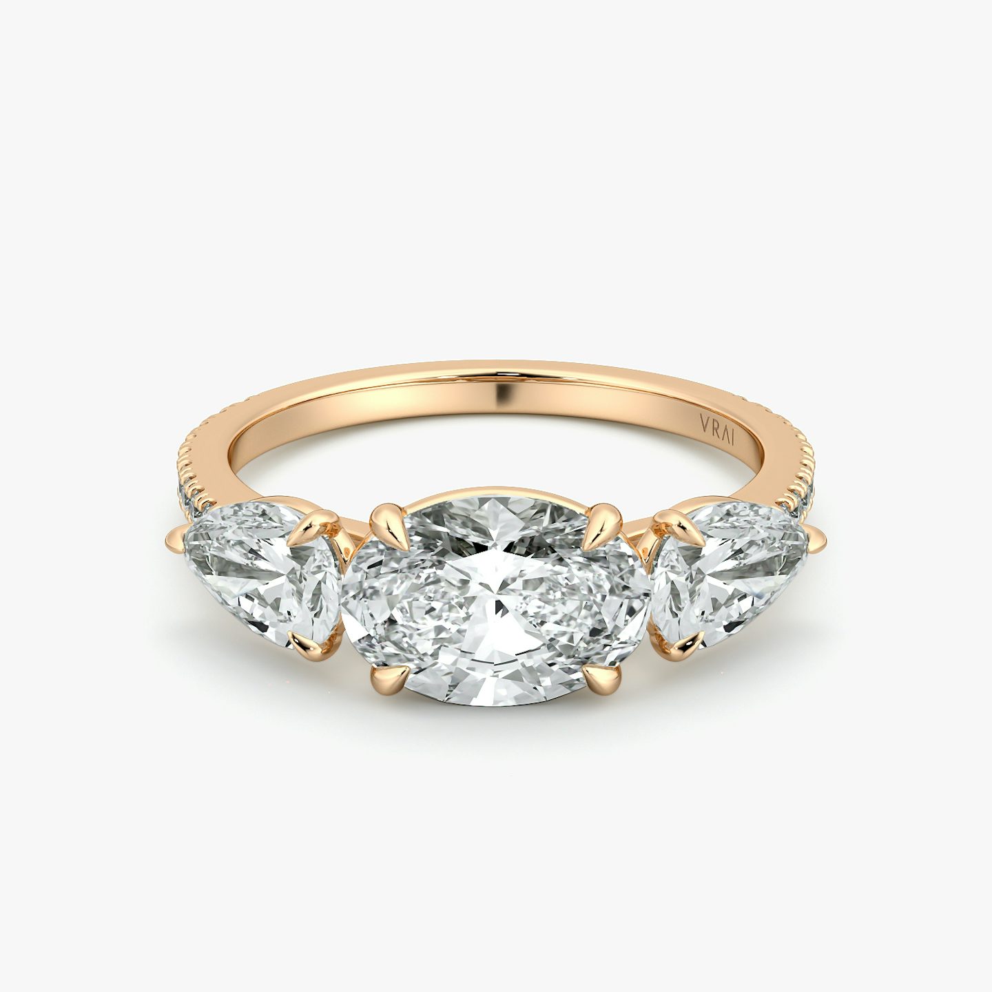 The Three Stone | Oval | 14k | Rose Gold | bandAccent: Pavé | diamondOrientation: horizontal | sideStoneCarat: 0.50ct | sideStoneShape: Pear | caratWeight: other