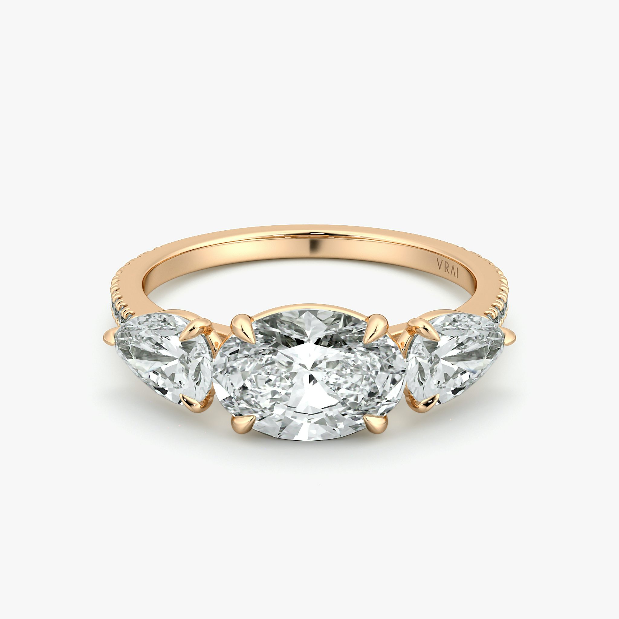 The Three Stone | Oval | 14k | Rose Gold | bandAccent: Pavé | diamondOrientation: horizontal | sideStoneCarat: 0.50ct | sideStoneShape: Pear | caratWeight: other