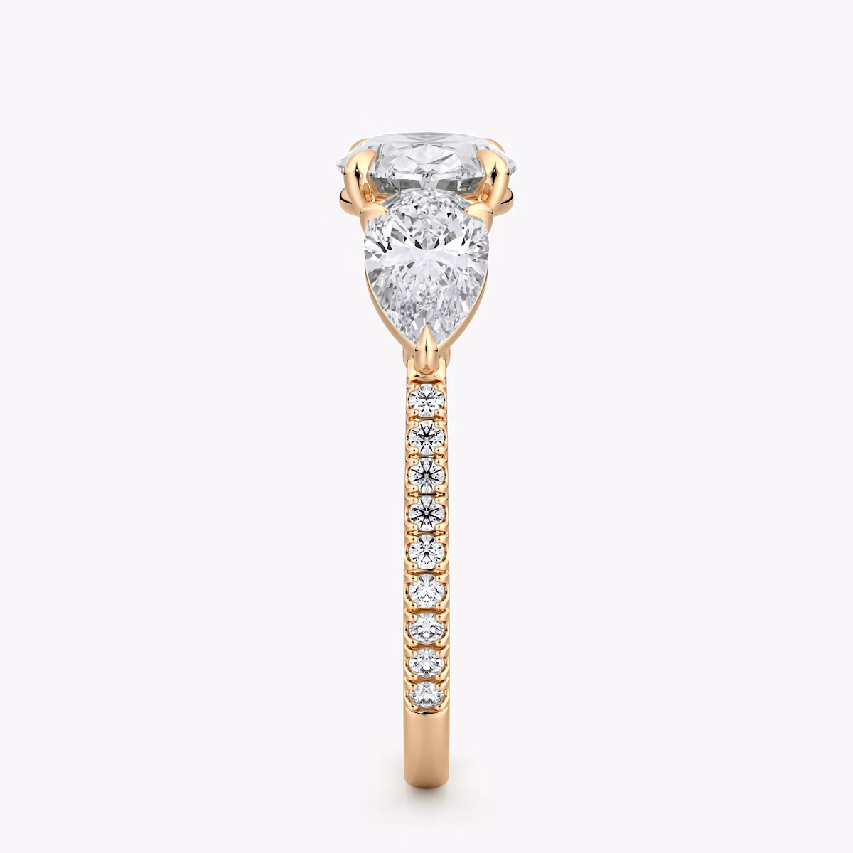 The Three Stone | Oval | 14k | Rose Gold | bandAccent: Pavé | diamondOrientation: horizontal | sideStoneCarat: 0.50ct | sideStoneShape: Pear | caratWeight: other