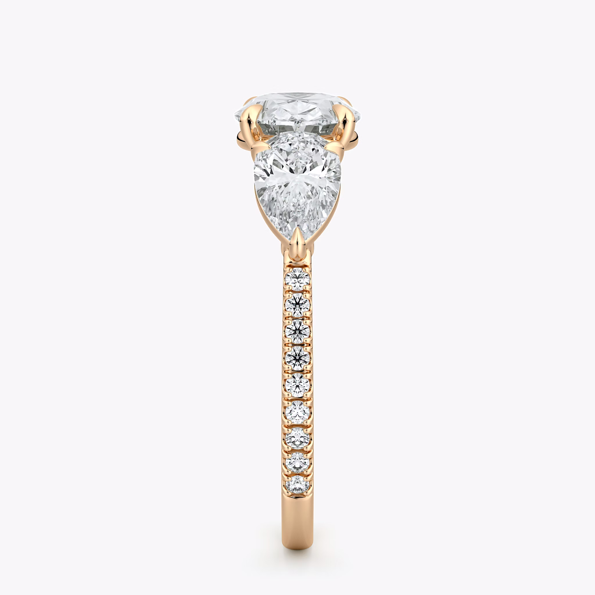 The Three Stone | Oval | 14k | Rose Gold | bandAccent: Pavé | diamondOrientation: horizontal | sideStoneCarat: 0.50ct | sideStoneShape: Pear | caratWeight: other