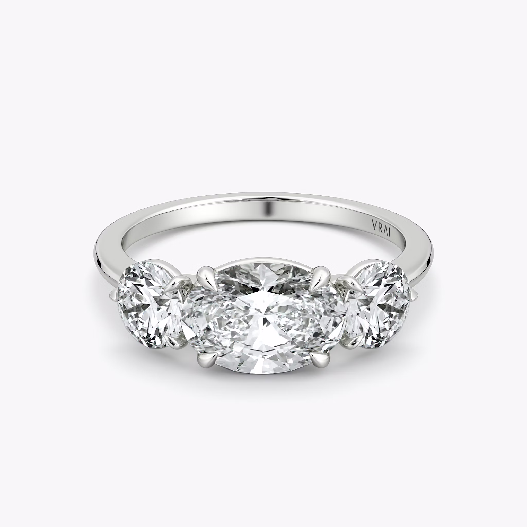 The Three Stone | Oval | 18k | White Gold | bandAccent: Plain | diamondOrientation: horizontal | sideStoneCarat: 0.50ct | sideStoneShape: Round Brilliant | caratWeight: other
