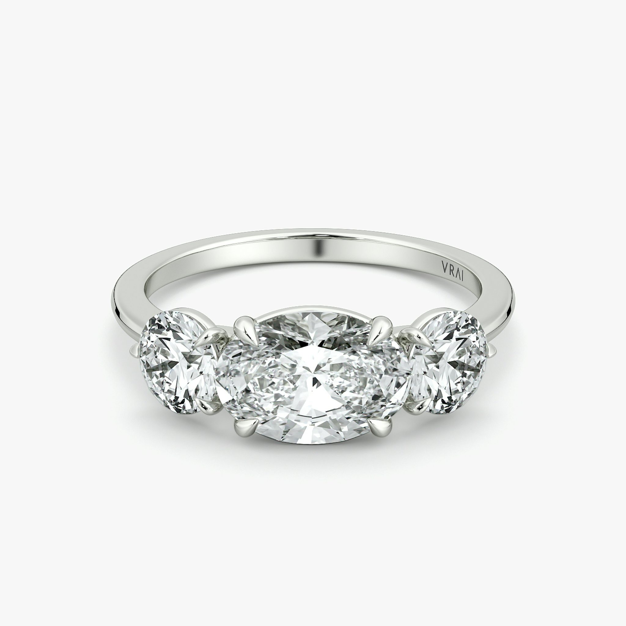The Three Stone | Oval | 18k | White Gold | bandAccent: Plain | diamondOrientation: horizontal | sideStoneCarat: 0.50ct | sideStoneShape: Round Brilliant | caratWeight: other