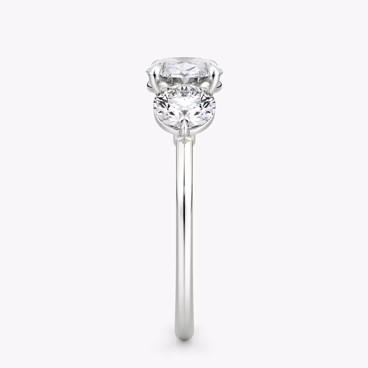The Three Stone | Oval | 18k | White Gold | bandAccent: Plain | diamondOrientation: horizontal | sideStoneCarat: 0.50ct | sideStoneShape: Round Brilliant | caratWeight: other