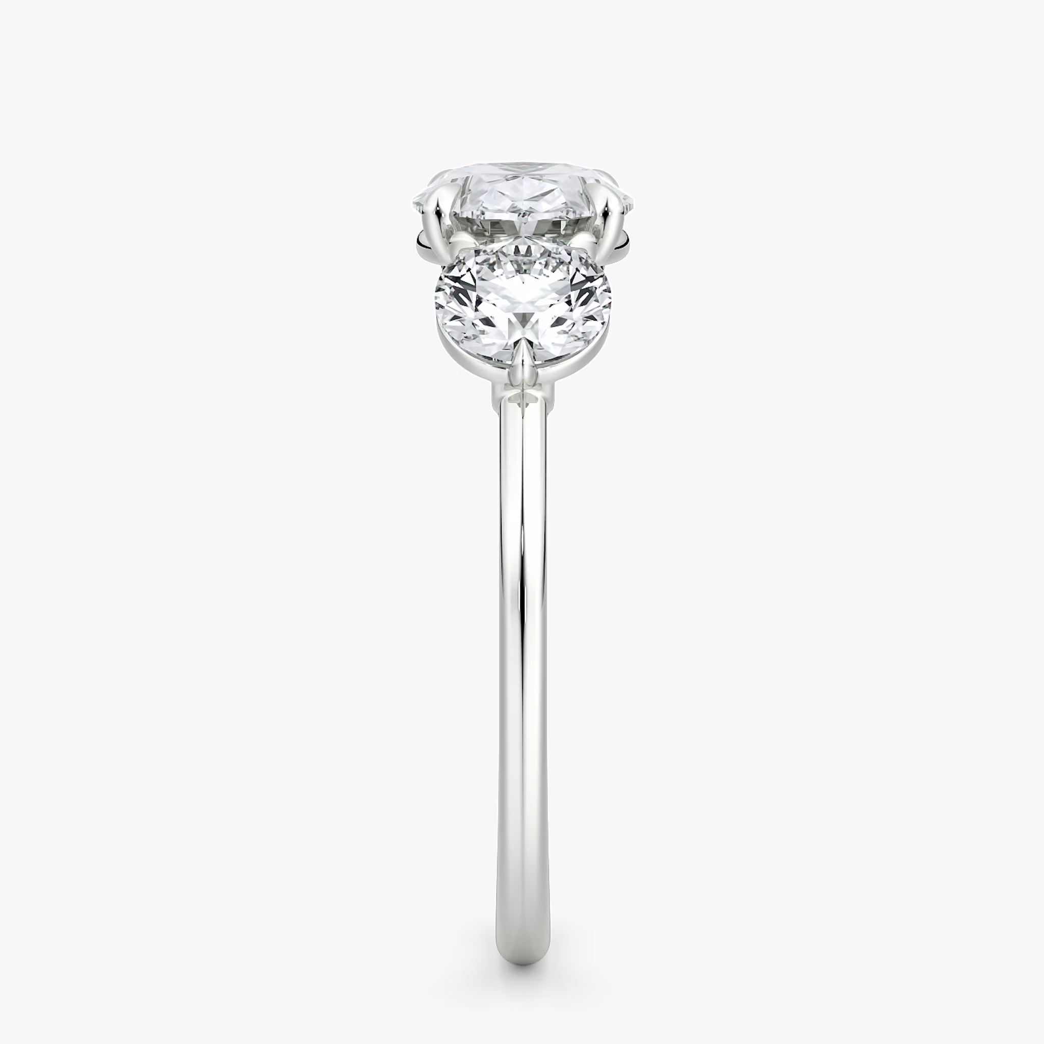 The Three Stone | Oval | 18k | White Gold | bandAccent: Plain | diamondOrientation: horizontal | sideStoneCarat: 0.50ct | sideStoneShape: Round Brilliant | caratWeight: other