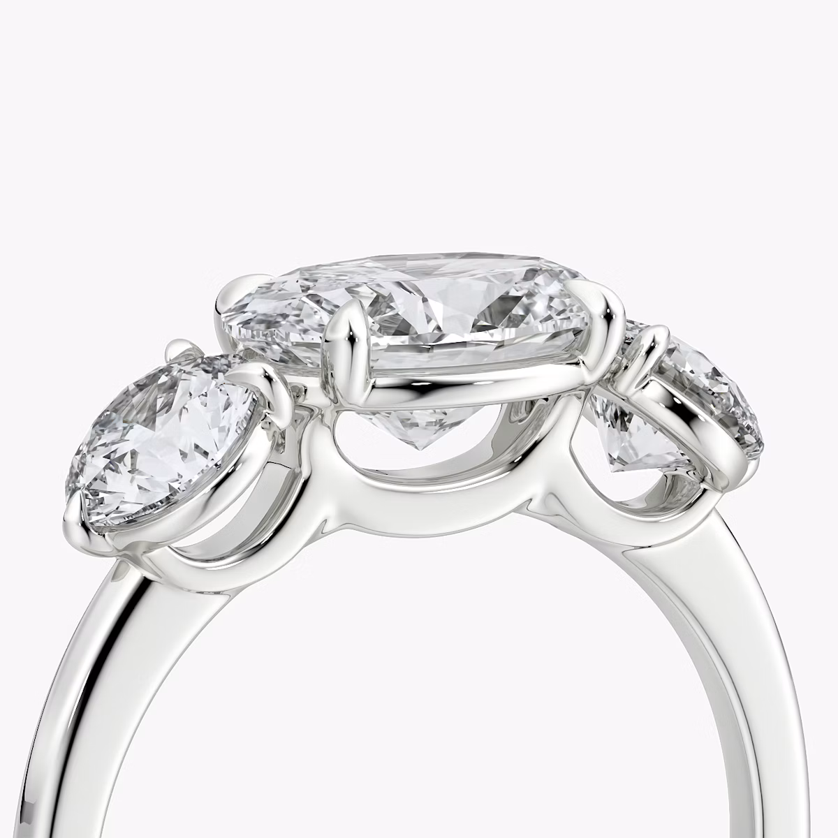 The Three Stone | Oval | 18k | White Gold | bandAccent: Plain | diamondOrientation: horizontal | sideStoneCarat: 0.50ct | sideStoneShape: Round Brilliant | caratWeight: other