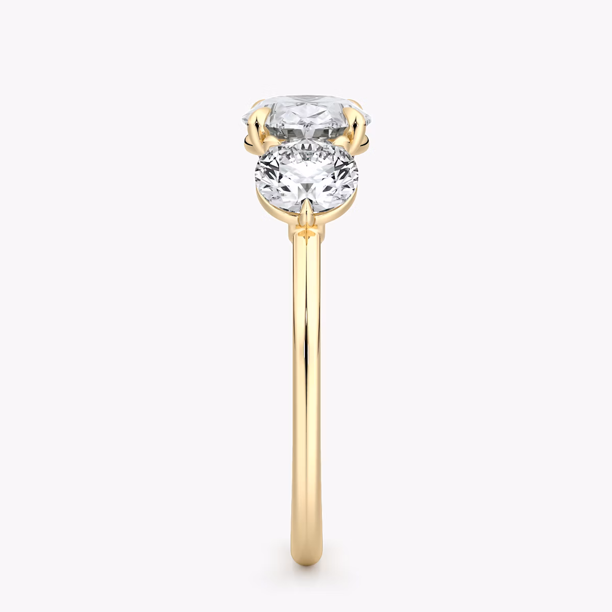 The Three Stone | Oval | 18k | Yellow Gold | bandAccent: Plain | diamondOrientation: horizontal | sideStoneCarat: 0.50ct | sideStoneShape: Round Brilliant | caratWeight: other