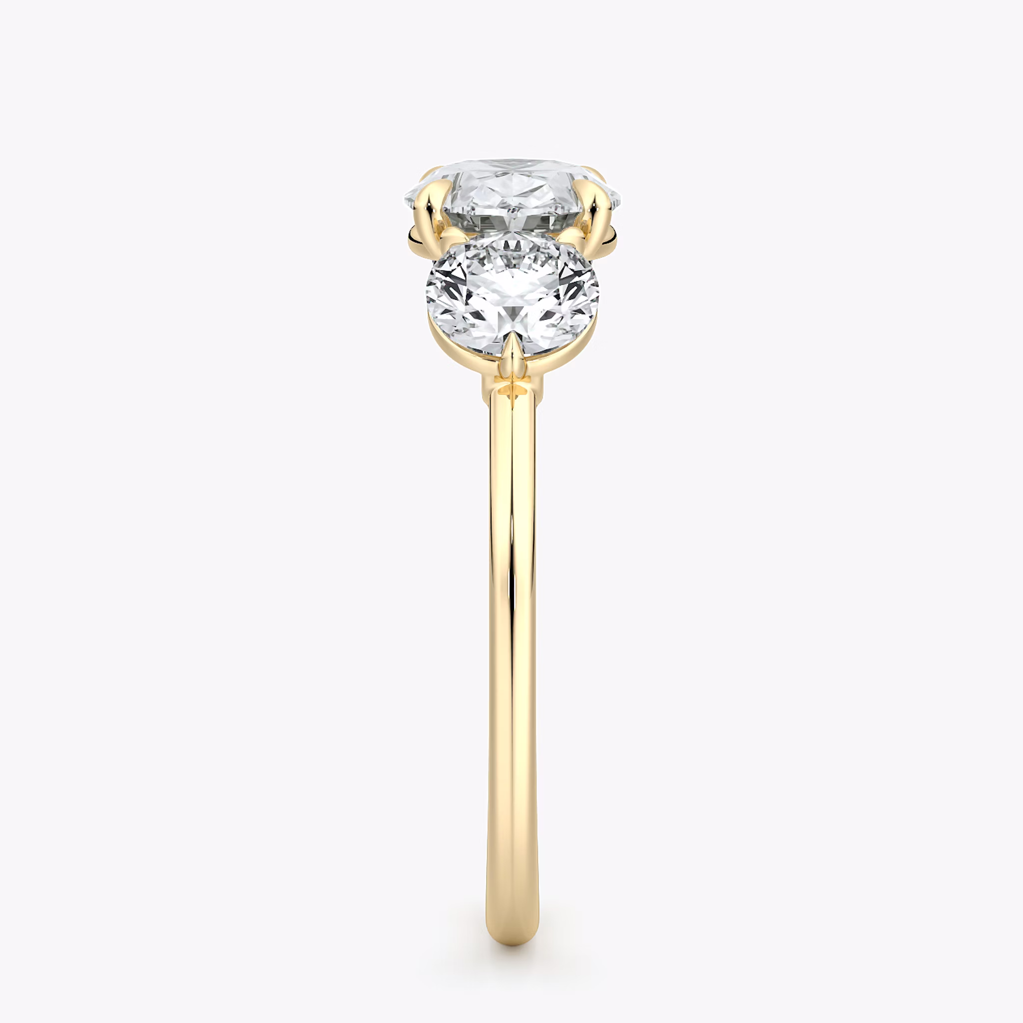 The Three Stone | Oval | 18k | Yellow Gold | bandAccent: Plain | diamondOrientation: horizontal | sideStoneCarat: 0.50ct | sideStoneShape: Round Brilliant | caratWeight: other