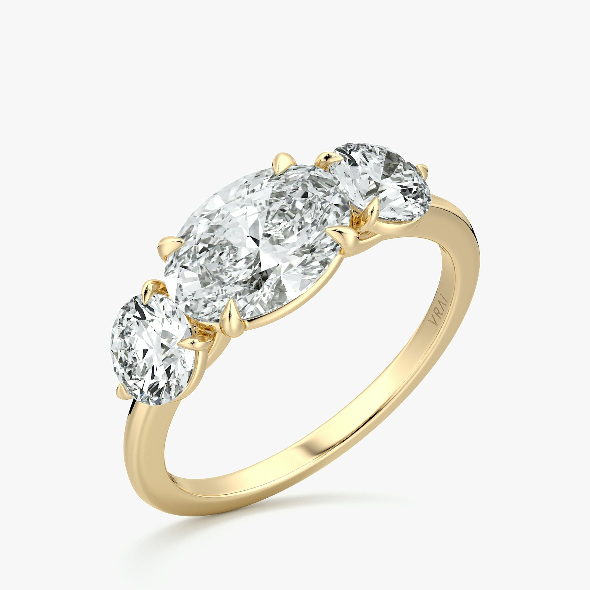 The Three Stone | Oval | 18k | Yellow Gold | bandAccent: Plain | diamondOrientation: horizontal | sideStoneCarat: 0.50ct | sideStoneShape: Round Brilliant | caratWeight: other
