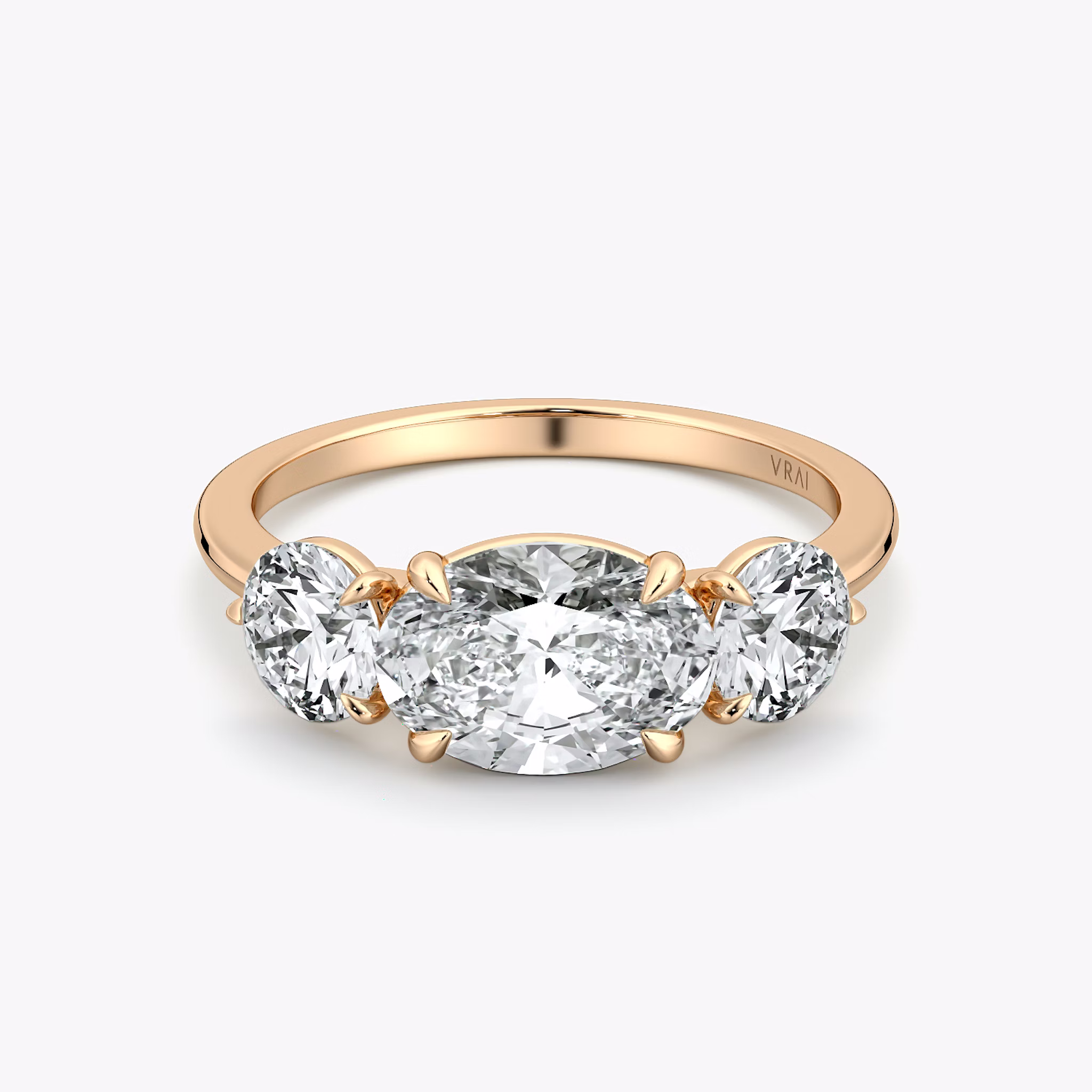 The Three Stone | Oval | 14k | Rose Gold | bandAccent: Plain | diamondOrientation: horizontal | sideStoneCarat: 0.50ct | sideStoneShape: Round Brilliant | caratWeight: other