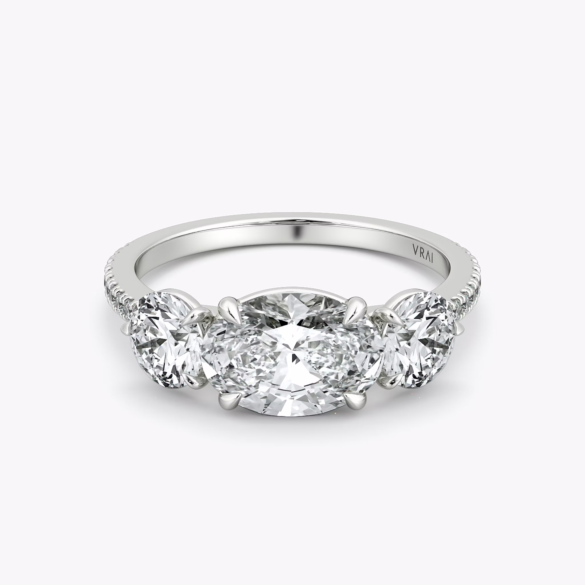 The Three Stone | Oval | 18k | White Gold | bandAccent: Pavé | diamondOrientation: horizontal | sideStoneCarat: 0.50ct | sideStoneShape: Round Brilliant | caratWeight: other