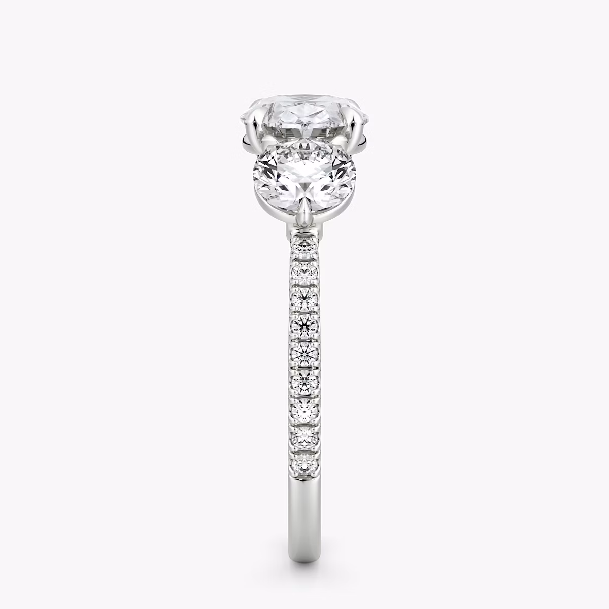 The Three Stone | Oval | 18k | White Gold | bandAccent: Pavé | diamondOrientation: horizontal | sideStoneCarat: 0.50ct | sideStoneShape: Round Brilliant | caratWeight: other