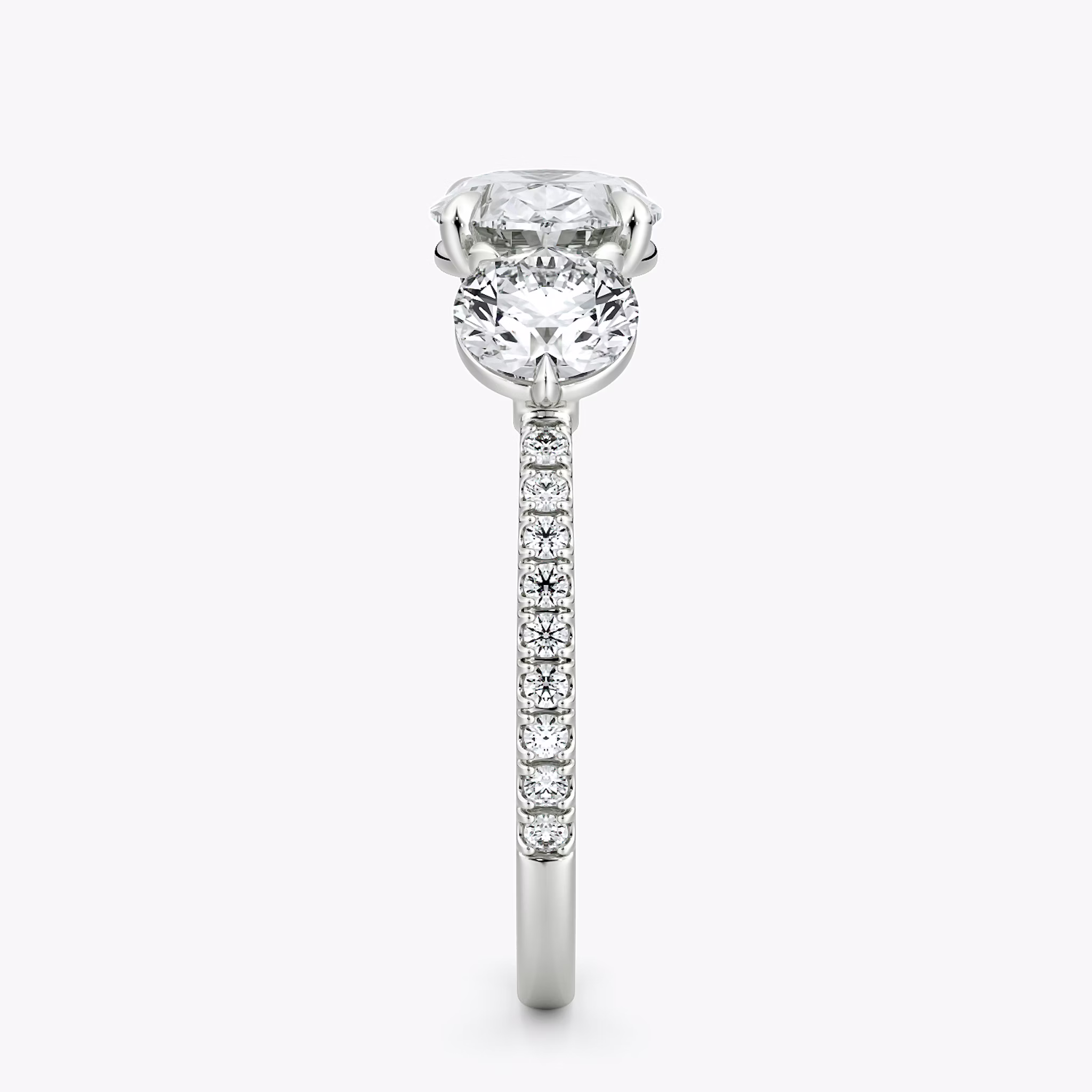 The Three Stone | Oval | 18k | White Gold | bandAccent: Pavé | diamondOrientation: horizontal | sideStoneCarat: 0.50ct | sideStoneShape: Round Brilliant | caratWeight: other