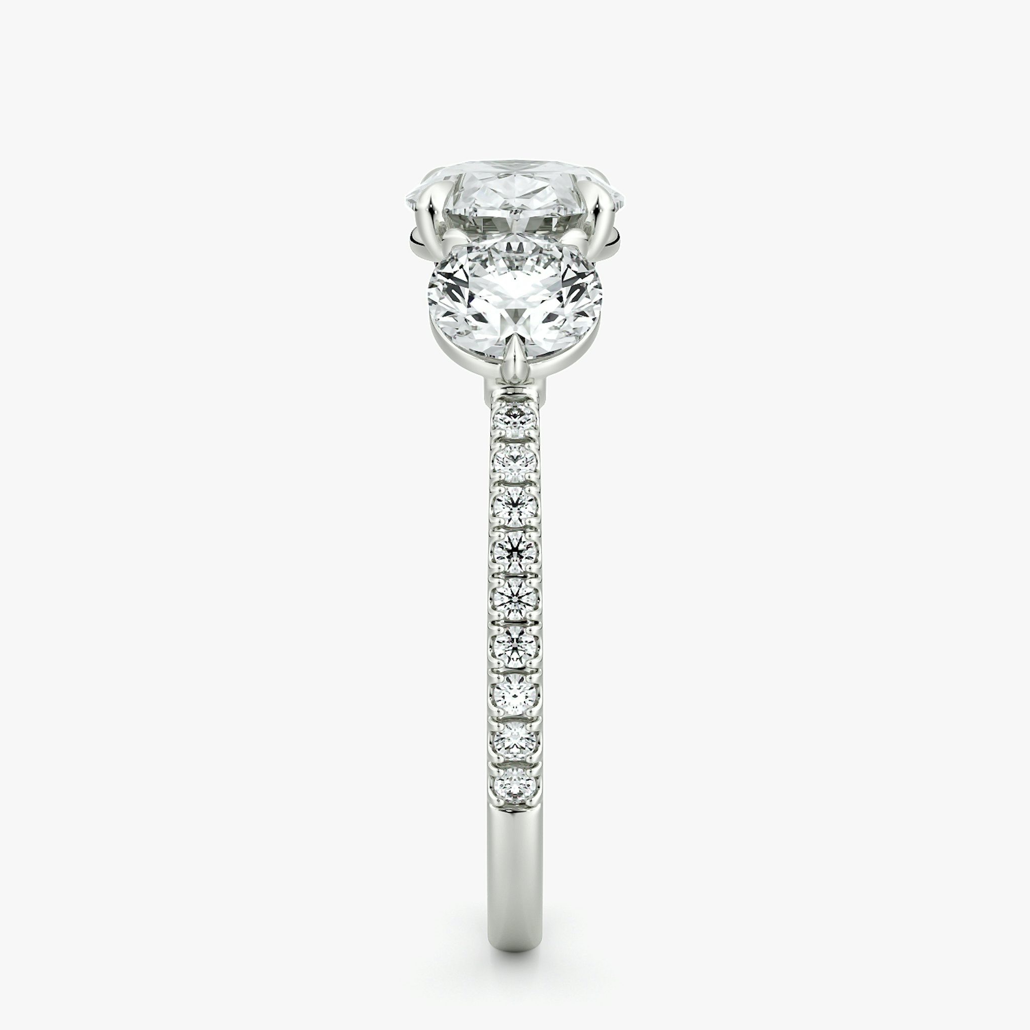 The Three Stone | Oval | 18k | White Gold | bandAccent: Pavé | diamondOrientation: horizontal | sideStoneCarat: 0.50ct | sideStoneShape: Round Brilliant | caratWeight: other