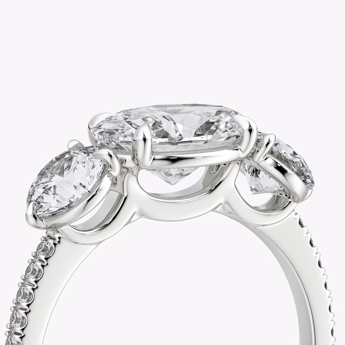 The Three Stone | Oval | 18k | White Gold | bandAccent: Pavé | diamondOrientation: horizontal | sideStoneCarat: 0.50ct | sideStoneShape: Round Brilliant | caratWeight: other