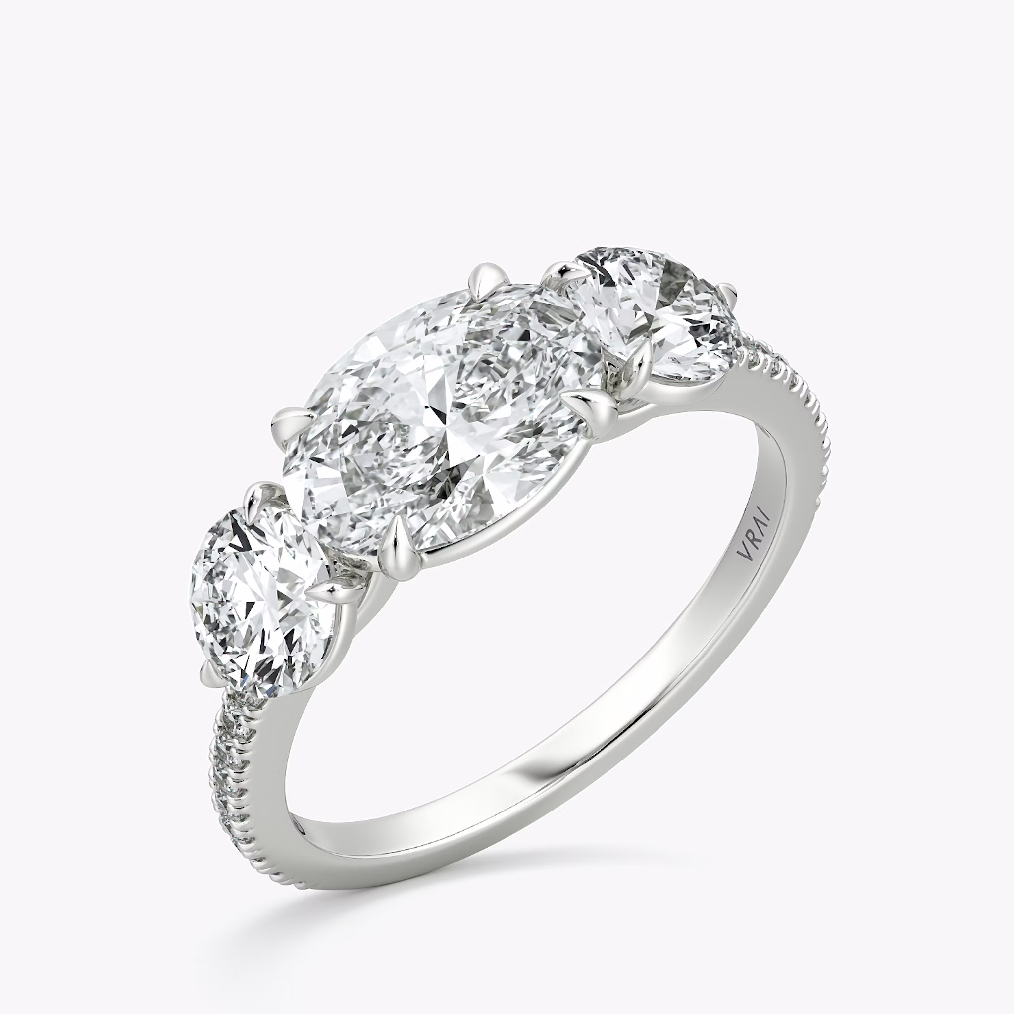 The Three Stone | Oval | 18k | White Gold | bandAccent: Pavé | diamondOrientation: horizontal | sideStoneCarat: 0.50ct | sideStoneShape: Round Brilliant | caratWeight: other