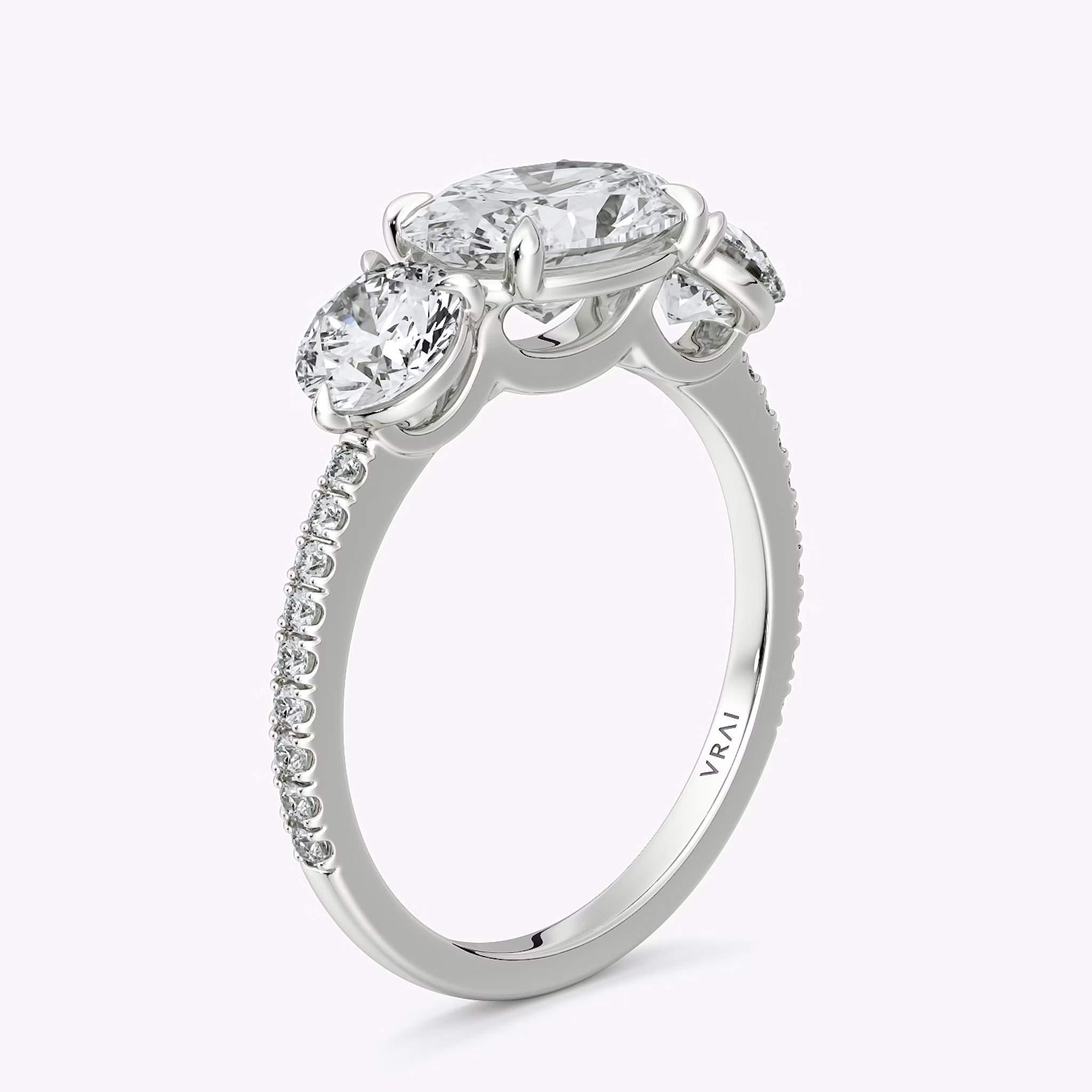 The Three Stone | Oval | 18k | White Gold | bandAccent: Pavé | diamondOrientation: horizontal | sideStoneCarat: 0.50ct | sideStoneShape: Round Brilliant | caratWeight: other