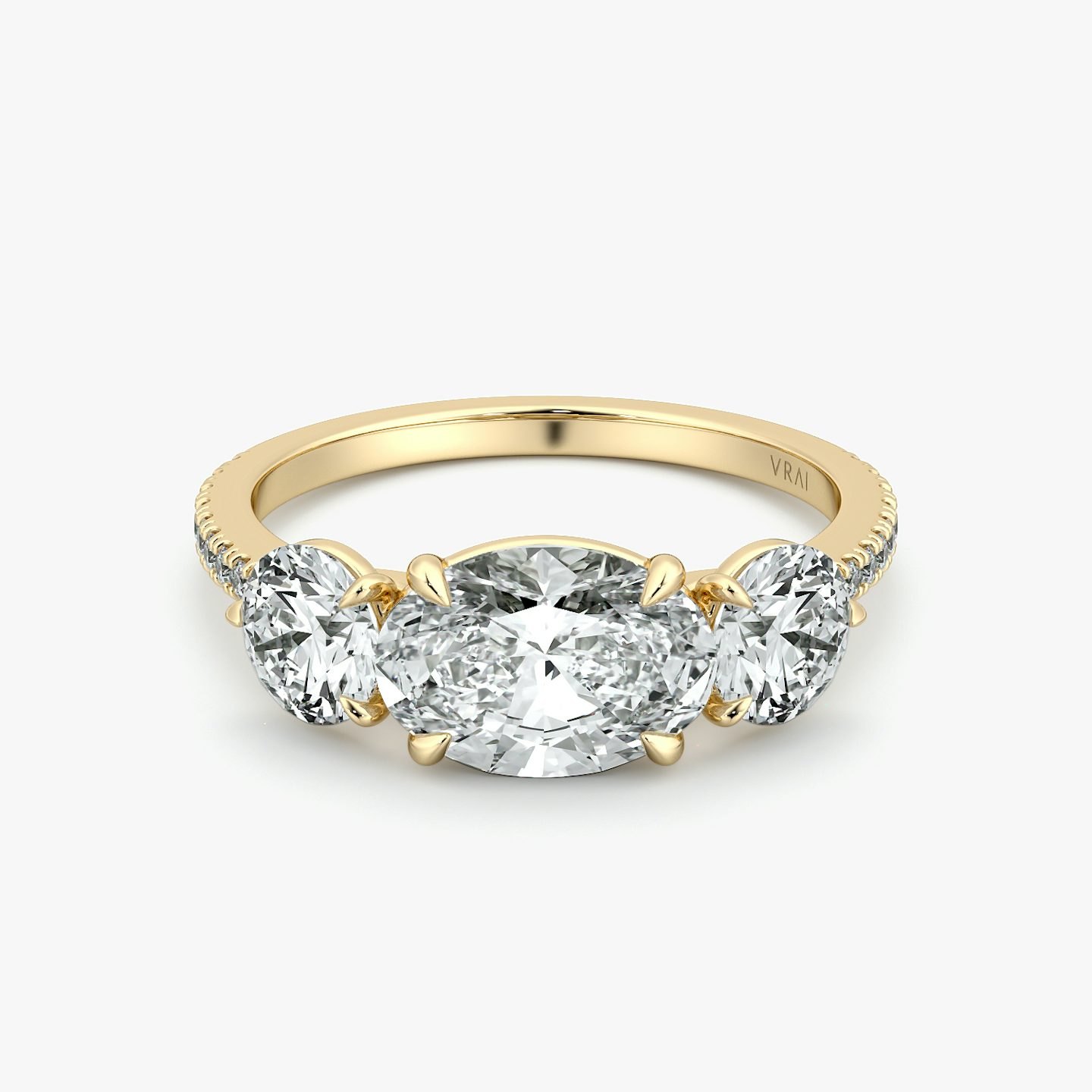 The Three Stone | Oval | 18k | Yellow Gold | bandAccent: Pavé | diamondOrientation: horizontal | sideStoneCarat: 0.50ct | sideStoneShape: Round Brilliant | caratWeight: other