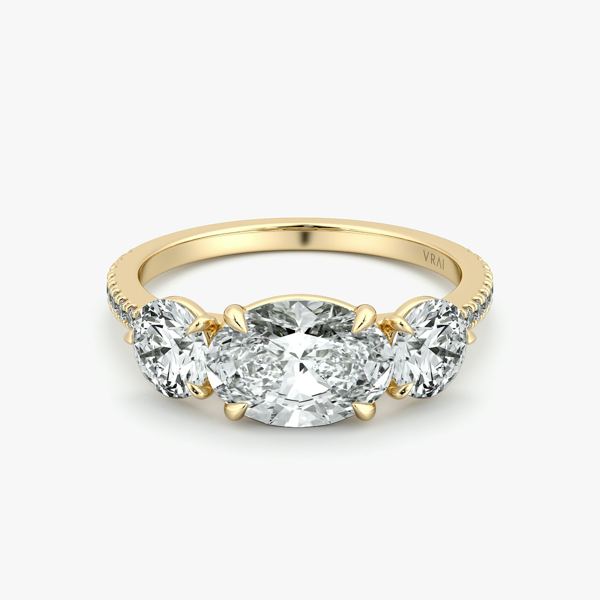 The Three Stone | Oval | 18k | Yellow Gold | bandAccent: Pavé | diamondOrientation: horizontal | sideStoneCarat: 0.50ct | sideStoneShape: Round Brilliant | caratWeight: other