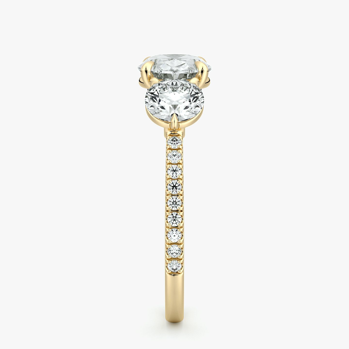 The Three Stone | Oval | 18k | Yellow Gold | bandAccent: Pavé | diamondOrientation: horizontal | sideStoneCarat: 0.50ct | sideStoneShape: Round Brilliant | caratWeight: other