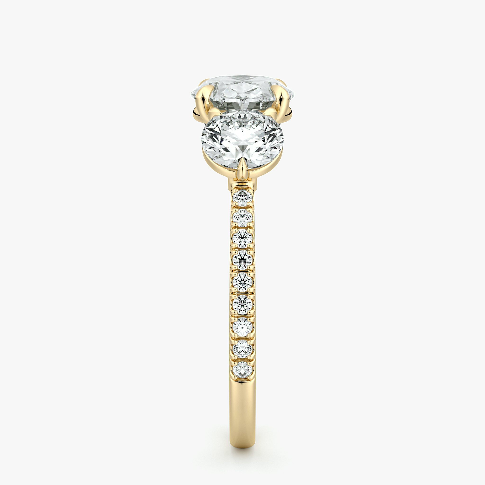 The Three Stone | Oval | 18k | Yellow Gold | bandAccent: Pavé | diamondOrientation: horizontal | sideStoneCarat: 0.50ct | sideStoneShape: Round Brilliant | caratWeight: other