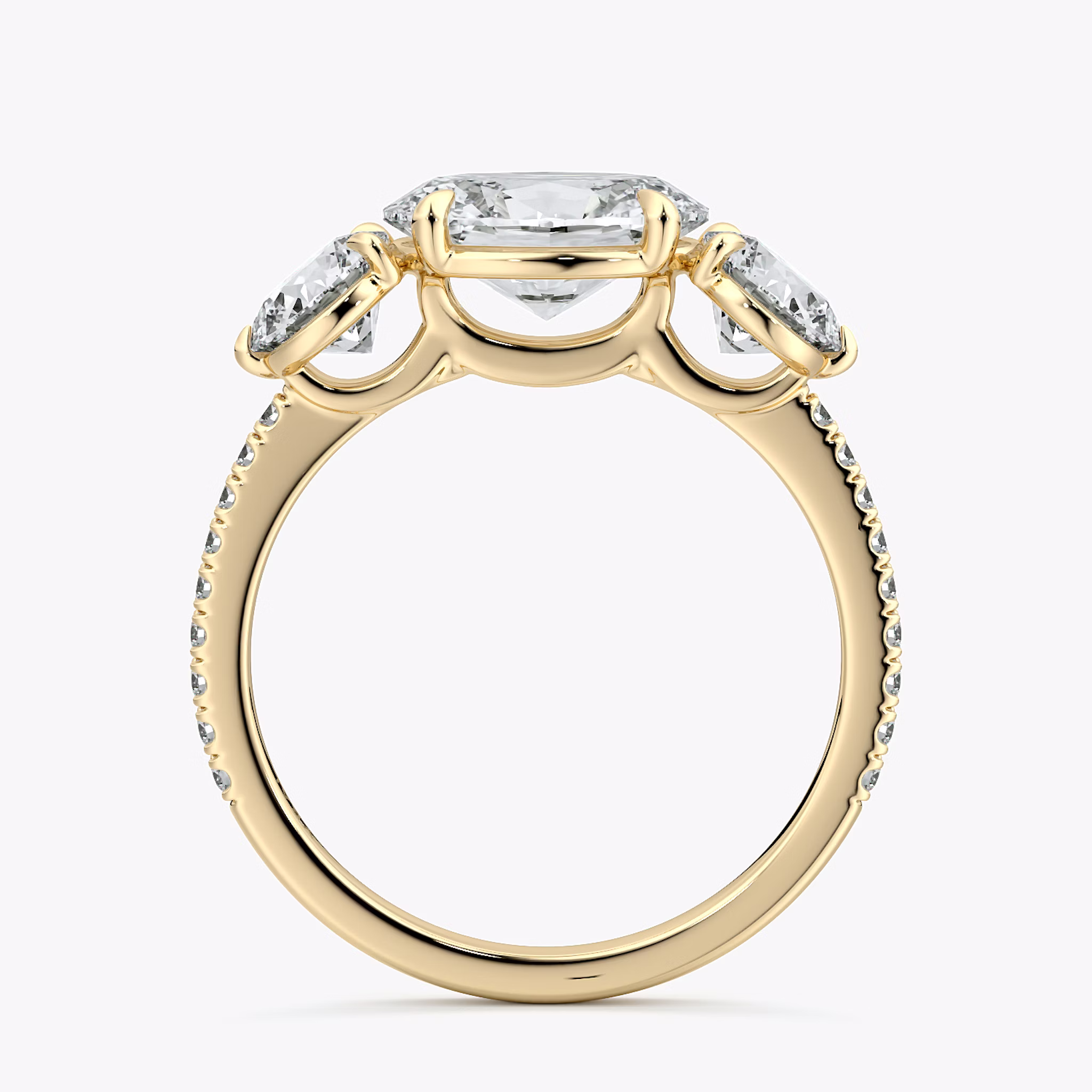 The Three Stone | Oval | 18k | Yellow Gold | bandAccent: Pavé | diamondOrientation: horizontal | sideStoneCarat: 0.50ct | sideStoneShape: Round Brilliant | caratWeight: other
