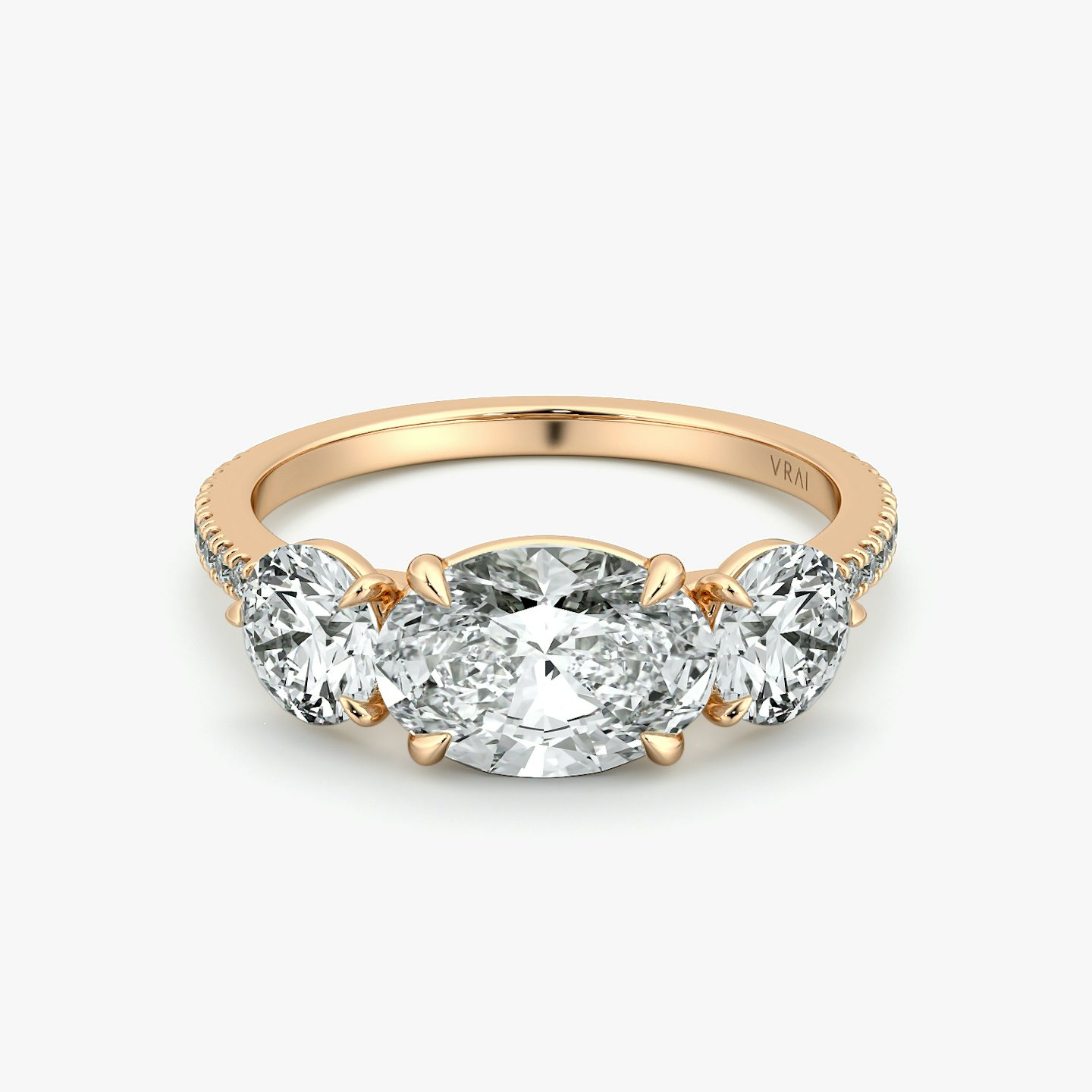 The Three Stone | Oval | 14k | Rose Gold | bandAccent: Pavé | diamondOrientation: horizontal | sideStoneCarat: 0.50ct | sideStoneShape: Round Brilliant | caratWeight: other
