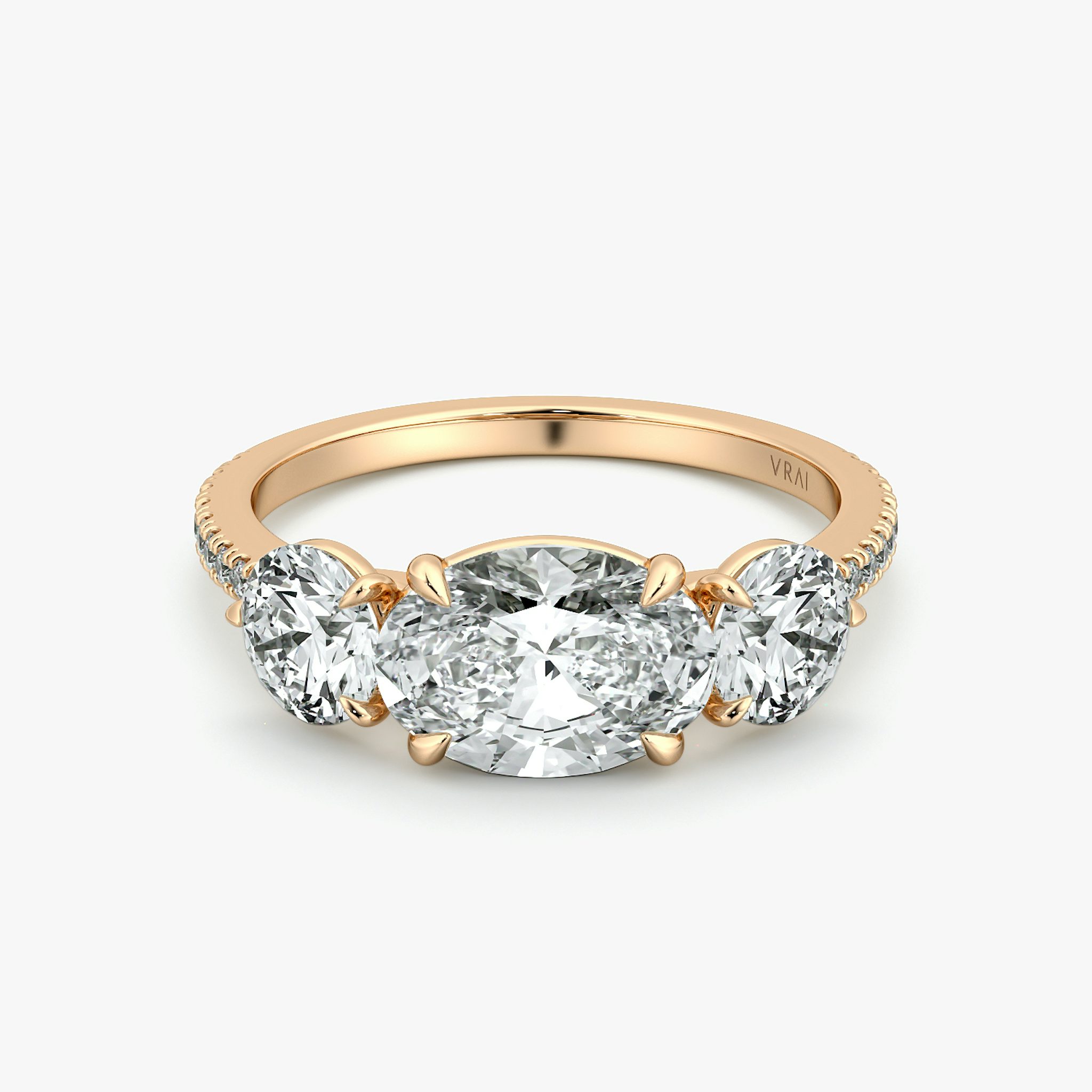 The Three Stone | Oval | 14k | Rose Gold | bandAccent: Pavé | diamondOrientation: horizontal | sideStoneCarat: 0.50ct | sideStoneShape: Round Brilliant | caratWeight: other