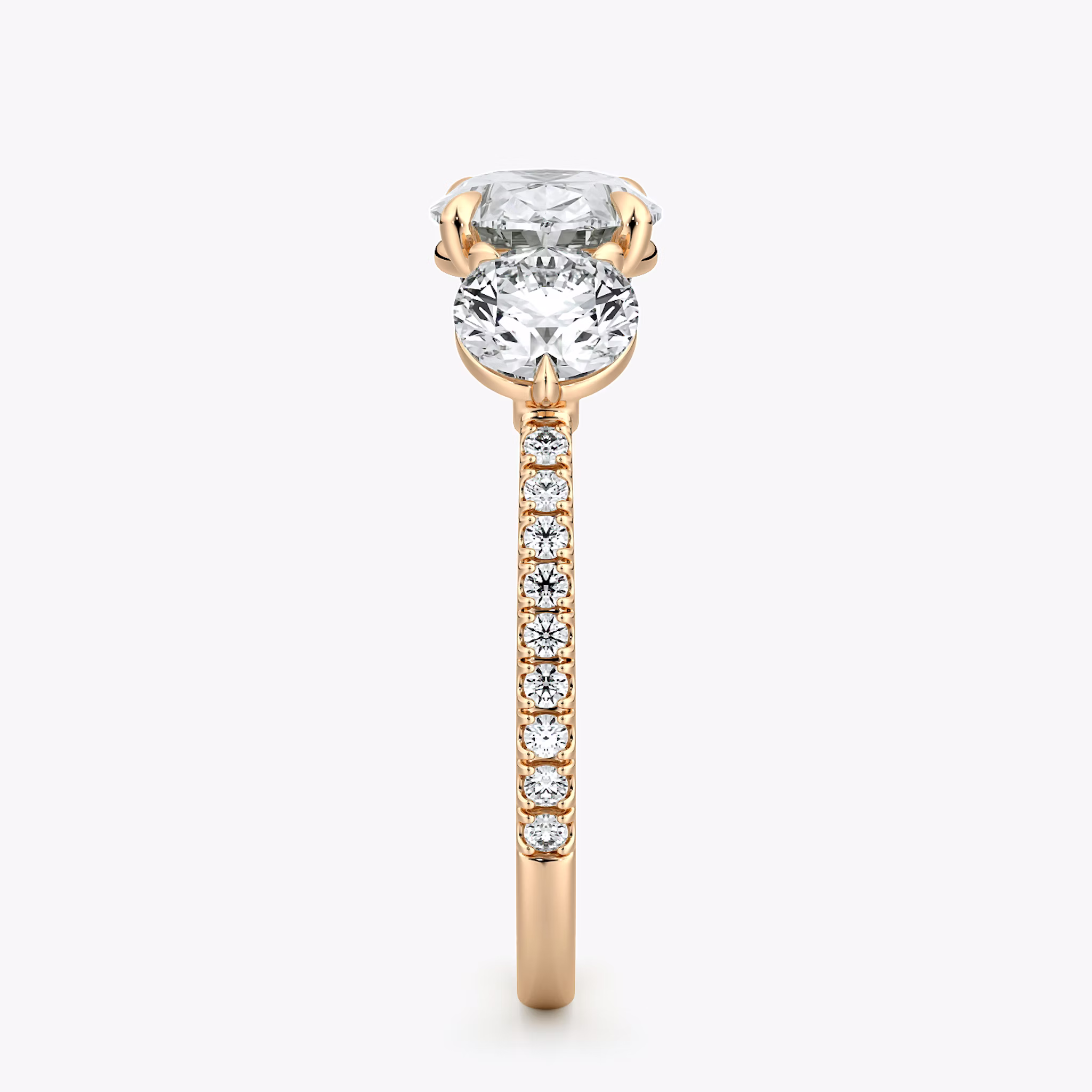 The Three Stone | Oval | 14k | Rose Gold | bandAccent: Pavé | diamondOrientation: horizontal | sideStoneCarat: 0.50ct | sideStoneShape: Round Brilliant | caratWeight: other