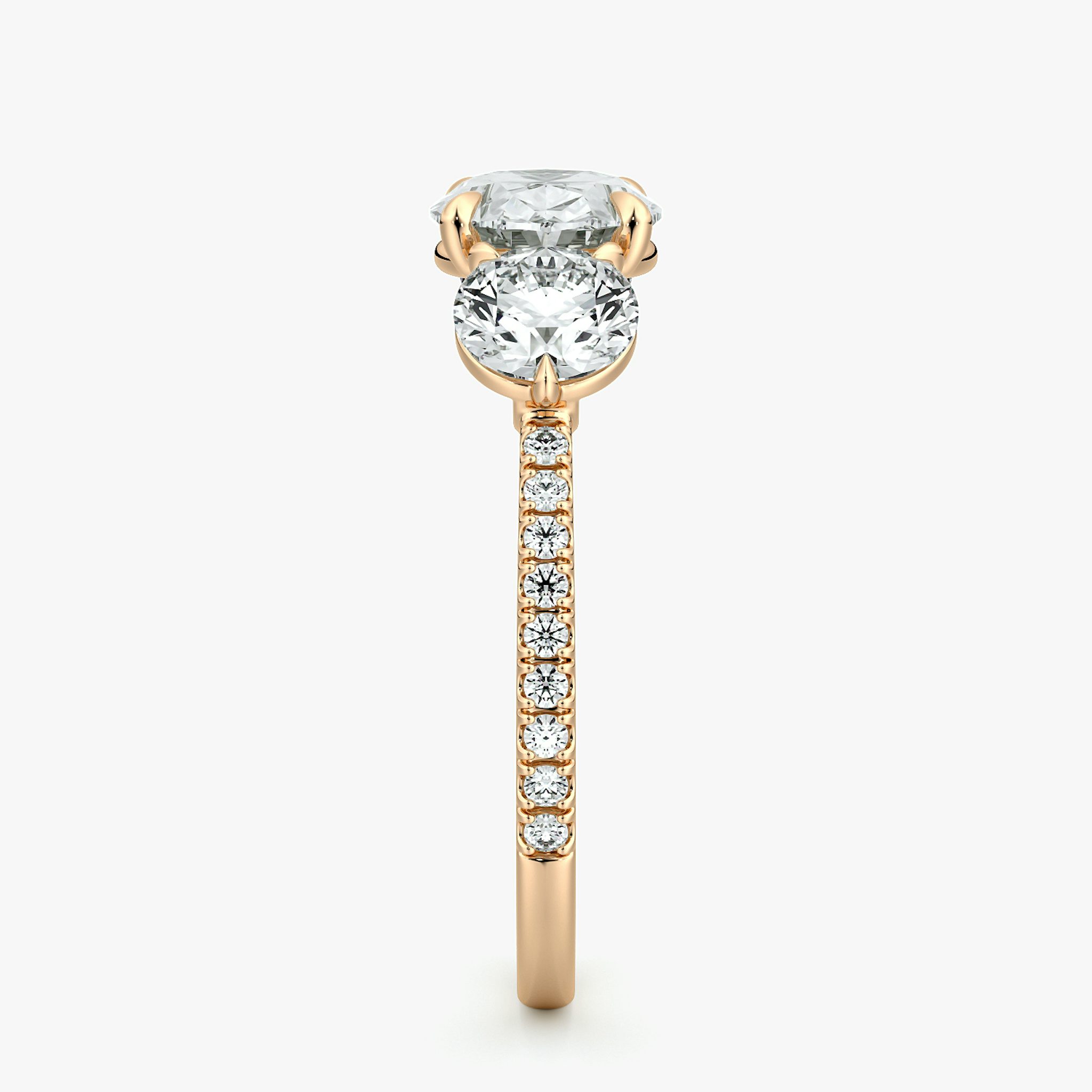 The Three Stone | Oval | 14k | Rose Gold | bandAccent: Pavé | diamondOrientation: horizontal | sideStoneCarat: 0.50ct | sideStoneShape: Round Brilliant | caratWeight: other